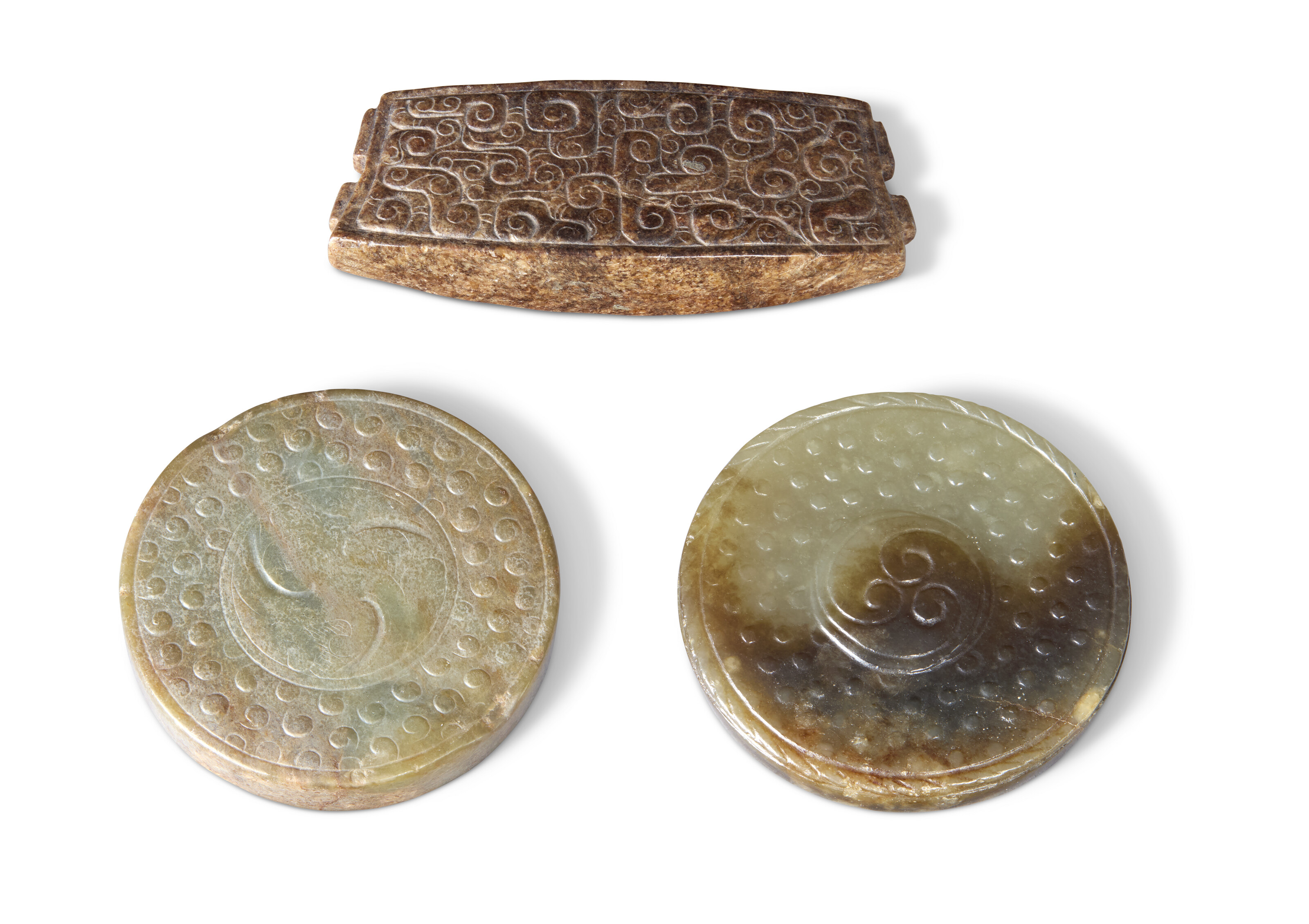 THREE CARVED JADE SWORD FITTINGS, CHINA, HAN DYNASTY AND LATER