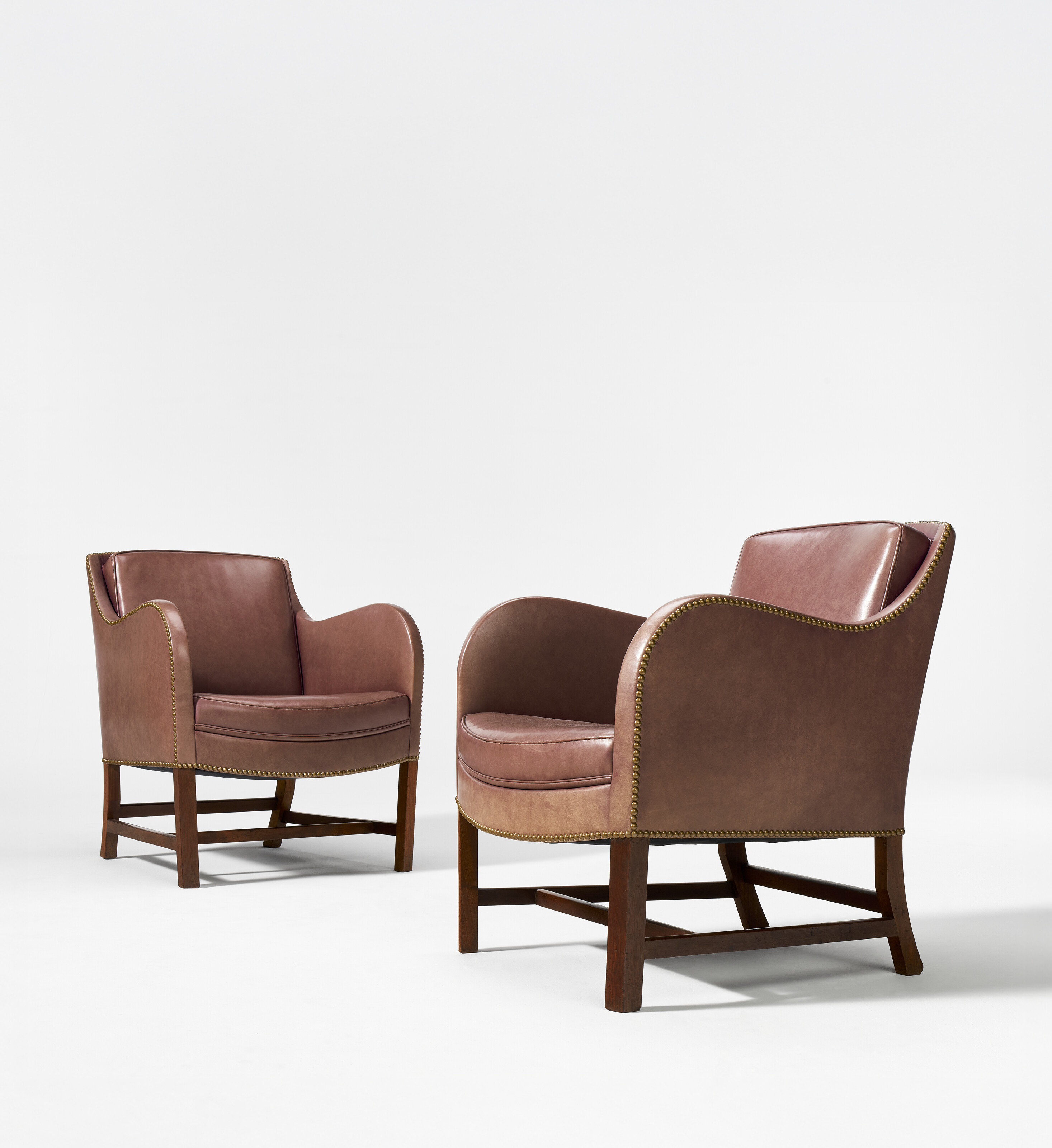 Kaare Klint and Edvard Kindt-Larsen, a pair of Mix easy chairs, model no. 4396, designed circa 1930, sold for $56,700 on 12 June 2025 at Christie's in New York