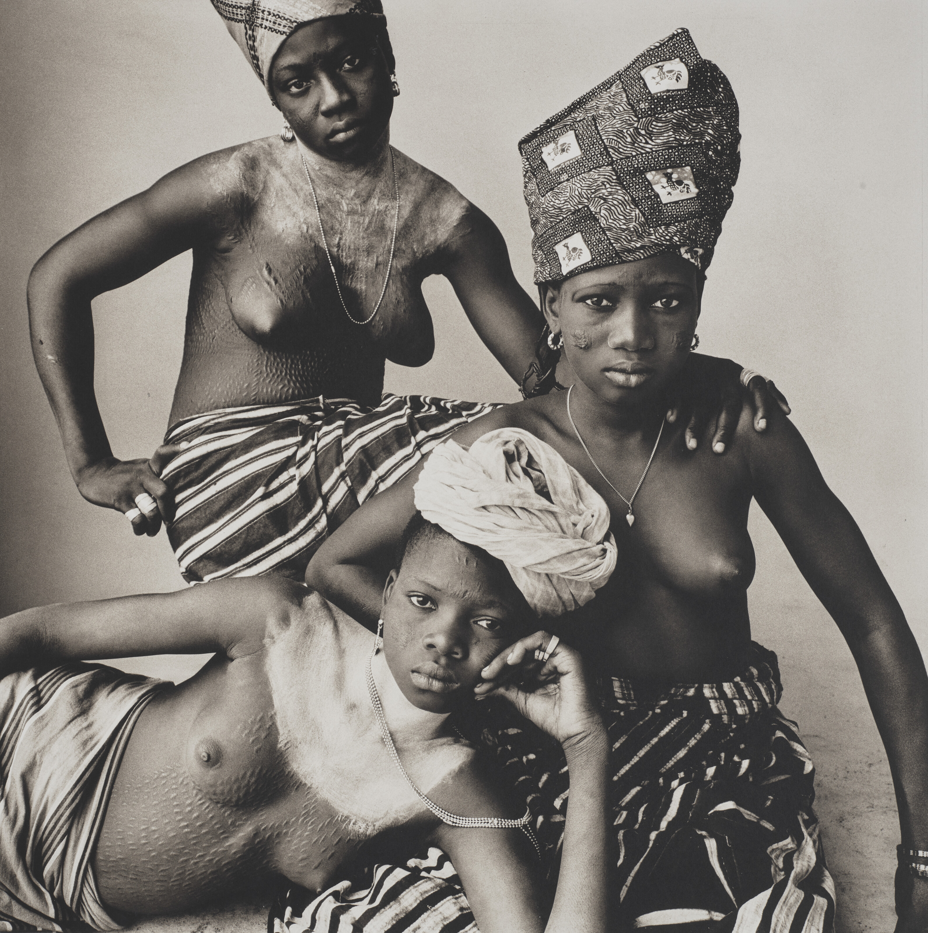 IRVING PENN (1917-2009), Three Dahomey Girls, One Reclining, 1967