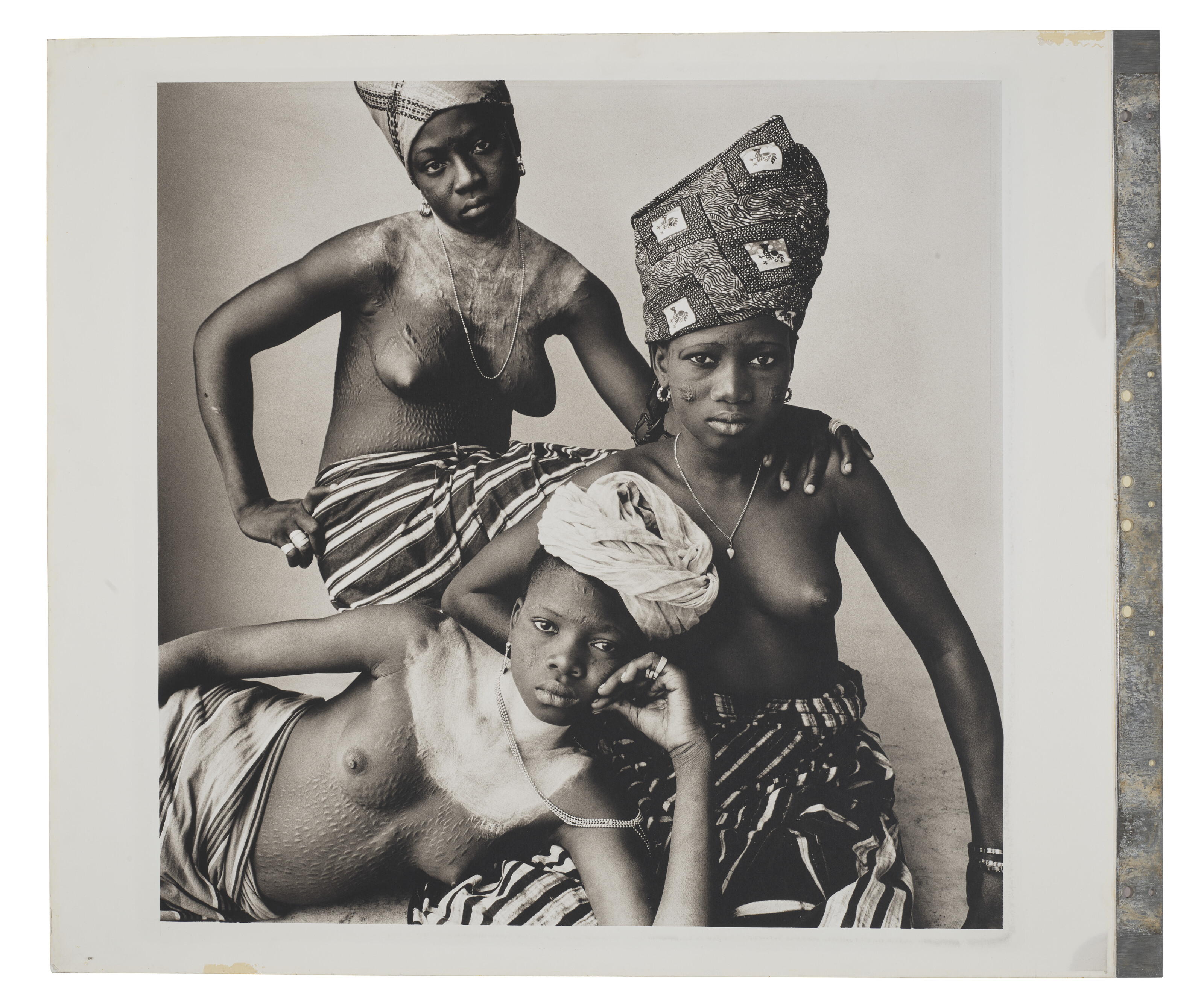 IRVING PENN (1917-2009), Three Dahomey Girls, One Reclining, 1967 