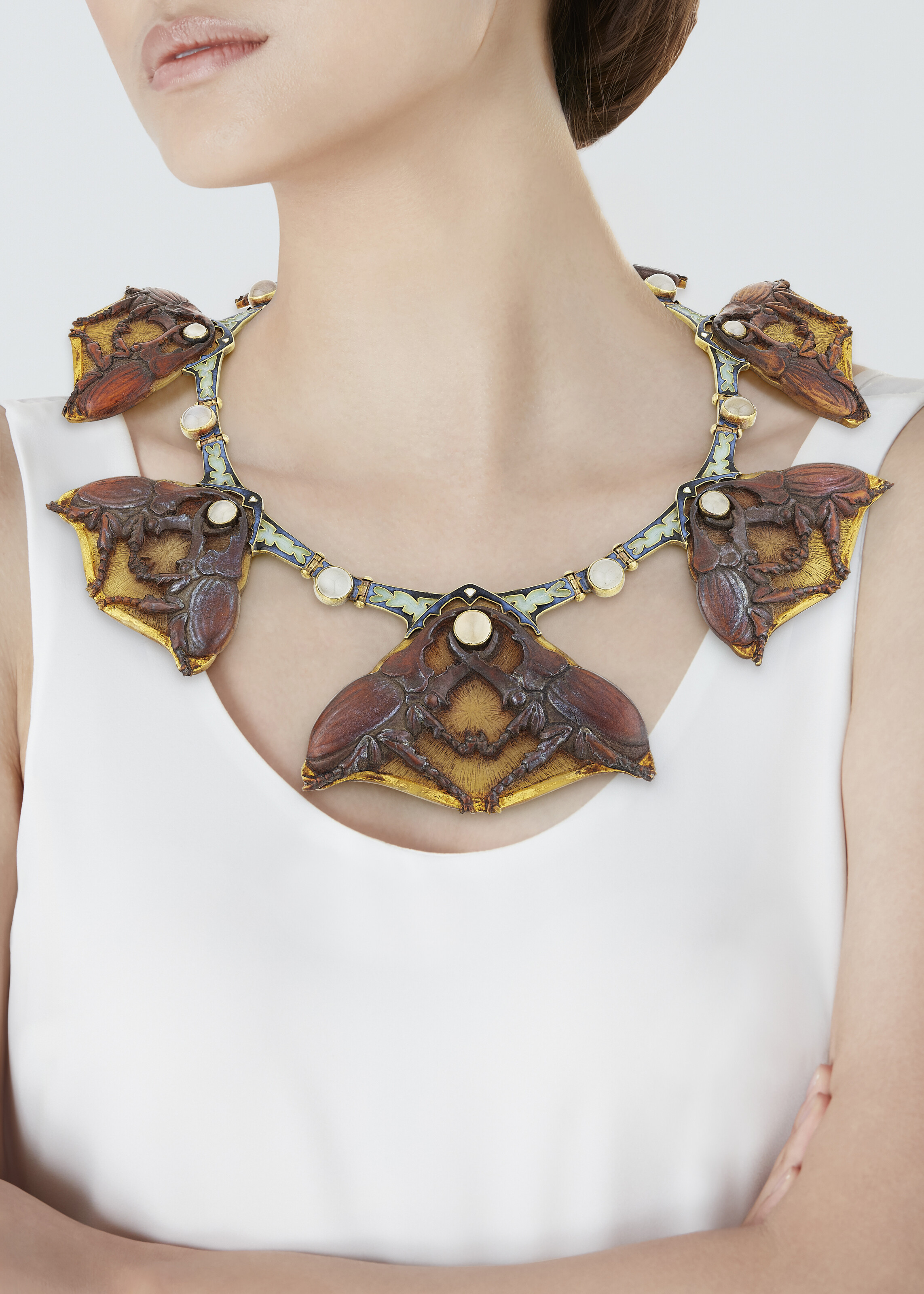 A RARE RENÉ LALIQUE ART NOUVEAU HORN, MOONSTONE AND ENAMEL