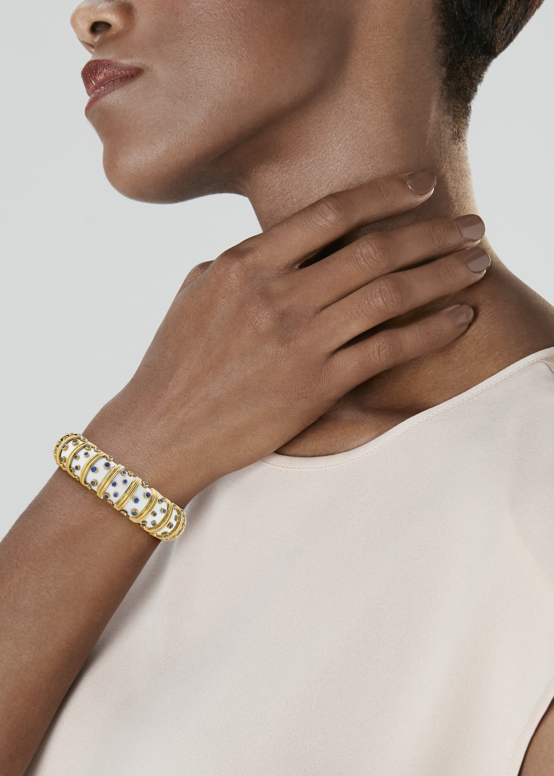 TIFFANY & CO., JEAN SCHLUMBERGER WHITE ENAMEL AND SAPPHIRE BANGLE