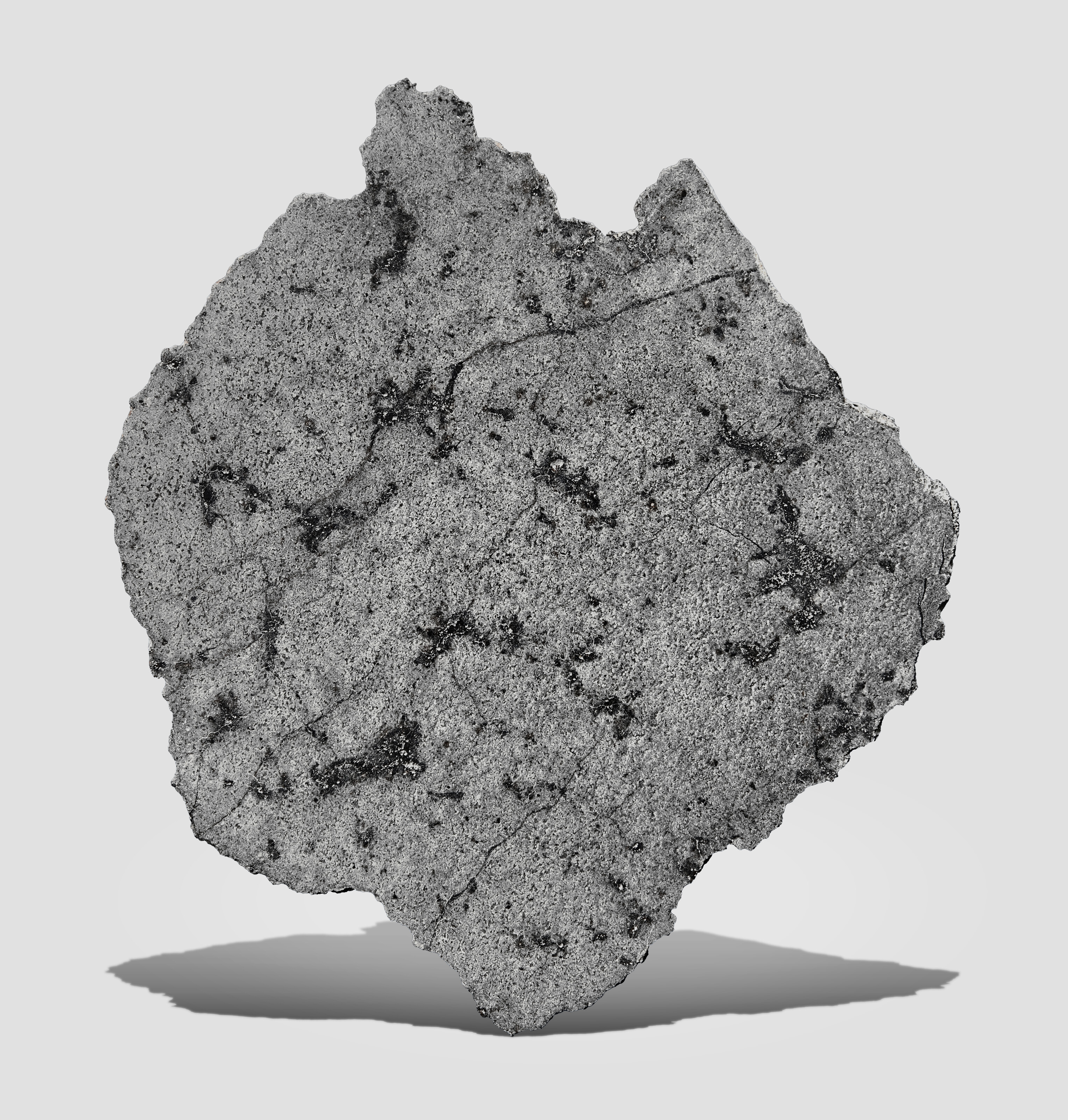 NWA 11057: large complete slice of the planet Mars with entrapped Martian atmosphere. Mars Rock - SNC Diabasic Shergottite; Sahara Desert, north-west Africa. As is the case with the Moon, specimens of the planet Mars are among the most exotic substances on Earth with less than 400 kilograms known to exist. The delivery mechanism to Earth was an asteroid impact on Mars that ejected material from the Martian surface into an Earth-crossing orbit, offered in Skybreakers: Between Heaven and Earth until 12 December 2025 at Christie's Online