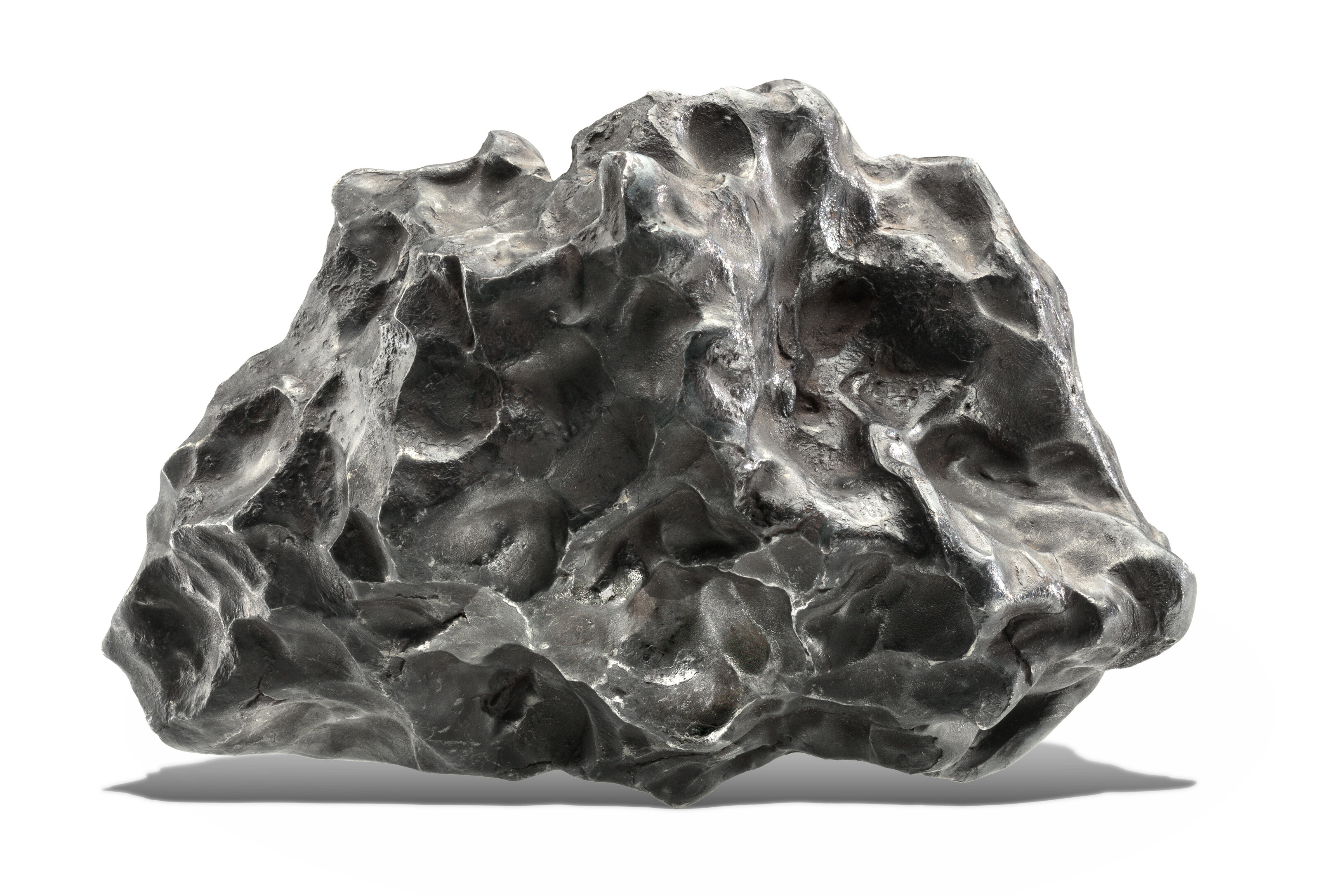 A FIST-SIZED SIKHOTE-ALIN METEORITE, Iron, coarsest octahedrite