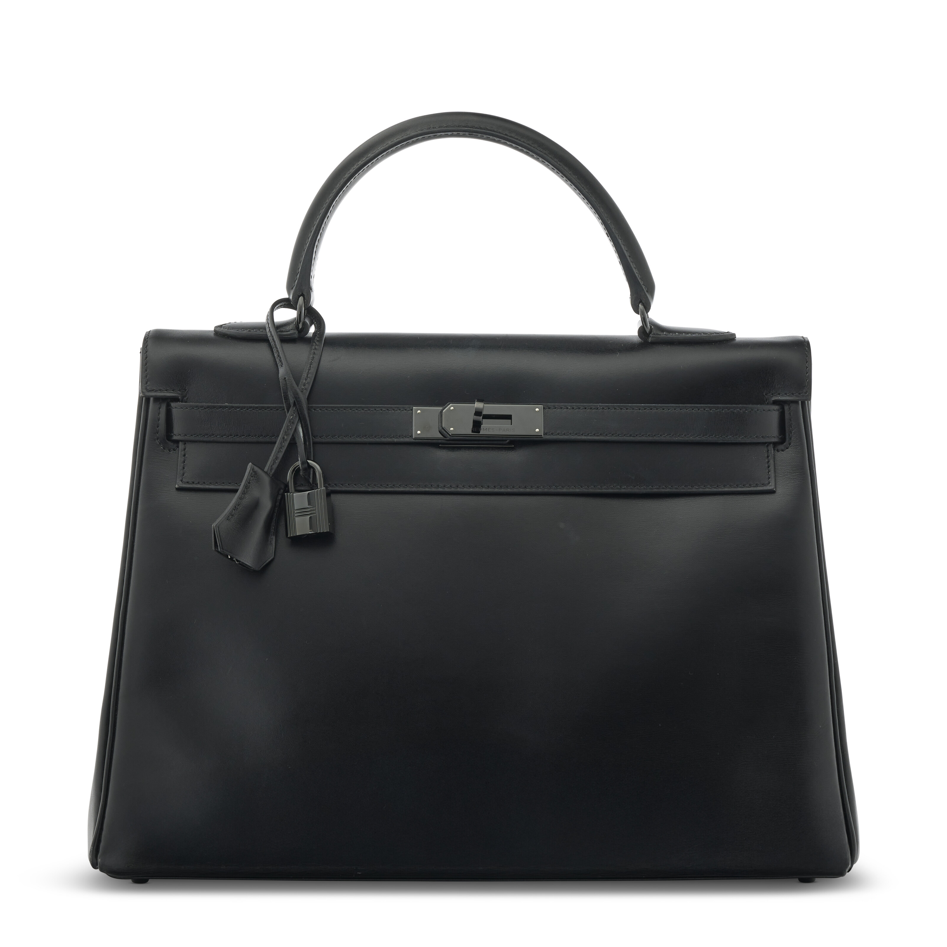 A limited edition Black Calf box leather Retourne So Black Kelly 35 with black PVD hardware, Hermes, 2010, offered in Handbags Online: The Paris Edit featuring Unlocking The Orange Dream Part II, until 29 April 2025 at Christie's Online