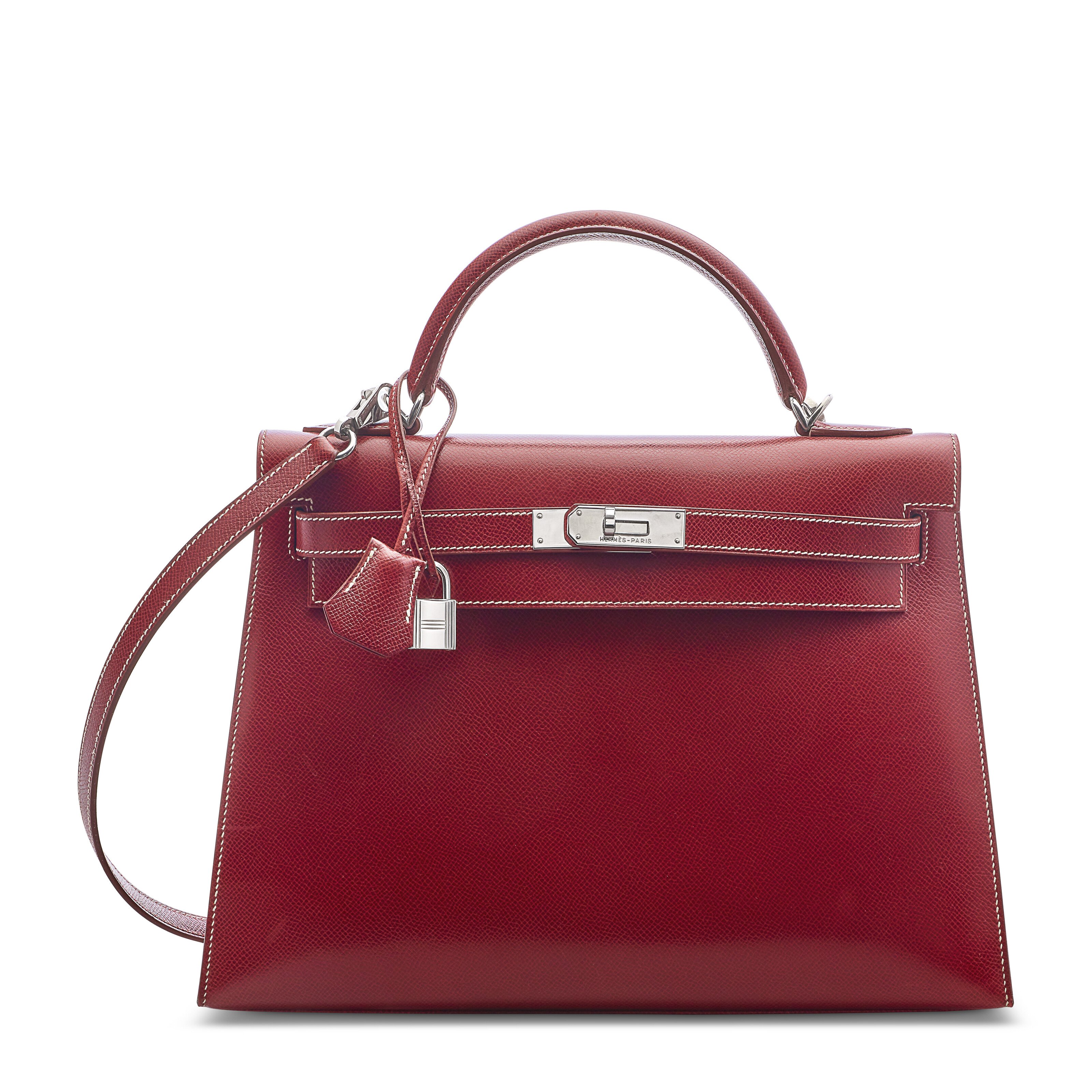 Hermes. A Rouge H Courchevel Leather Sellier Kelly 32 with palladium hardware, 2001, offered in Handbags: The Paris Edit until 13 November 2025 at Christie's Online