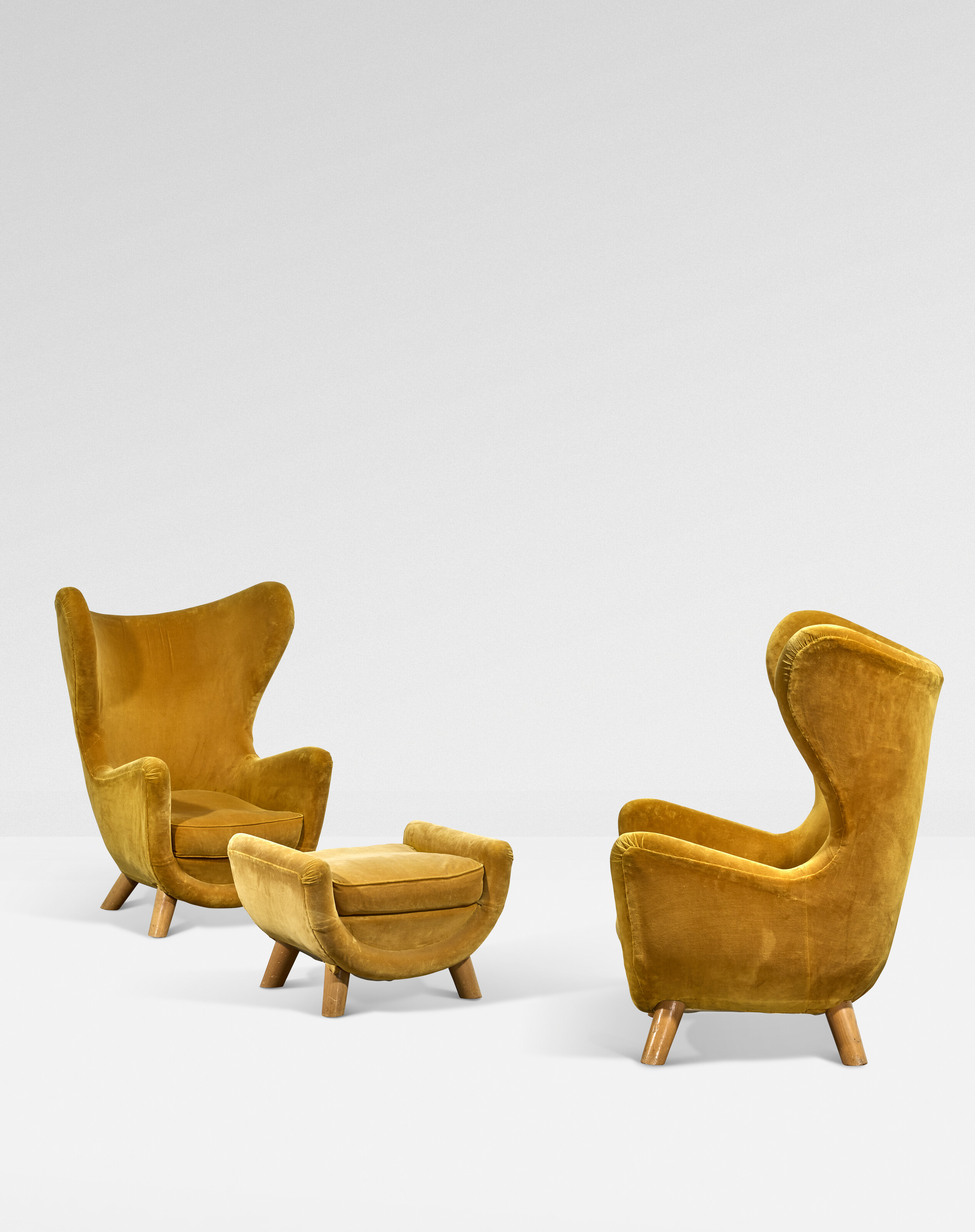 Jean Royere, a pair of Elephanteau armchairs and an ottoman, 1950, offered in Design on 21 May 2025 at Christie's in Paris