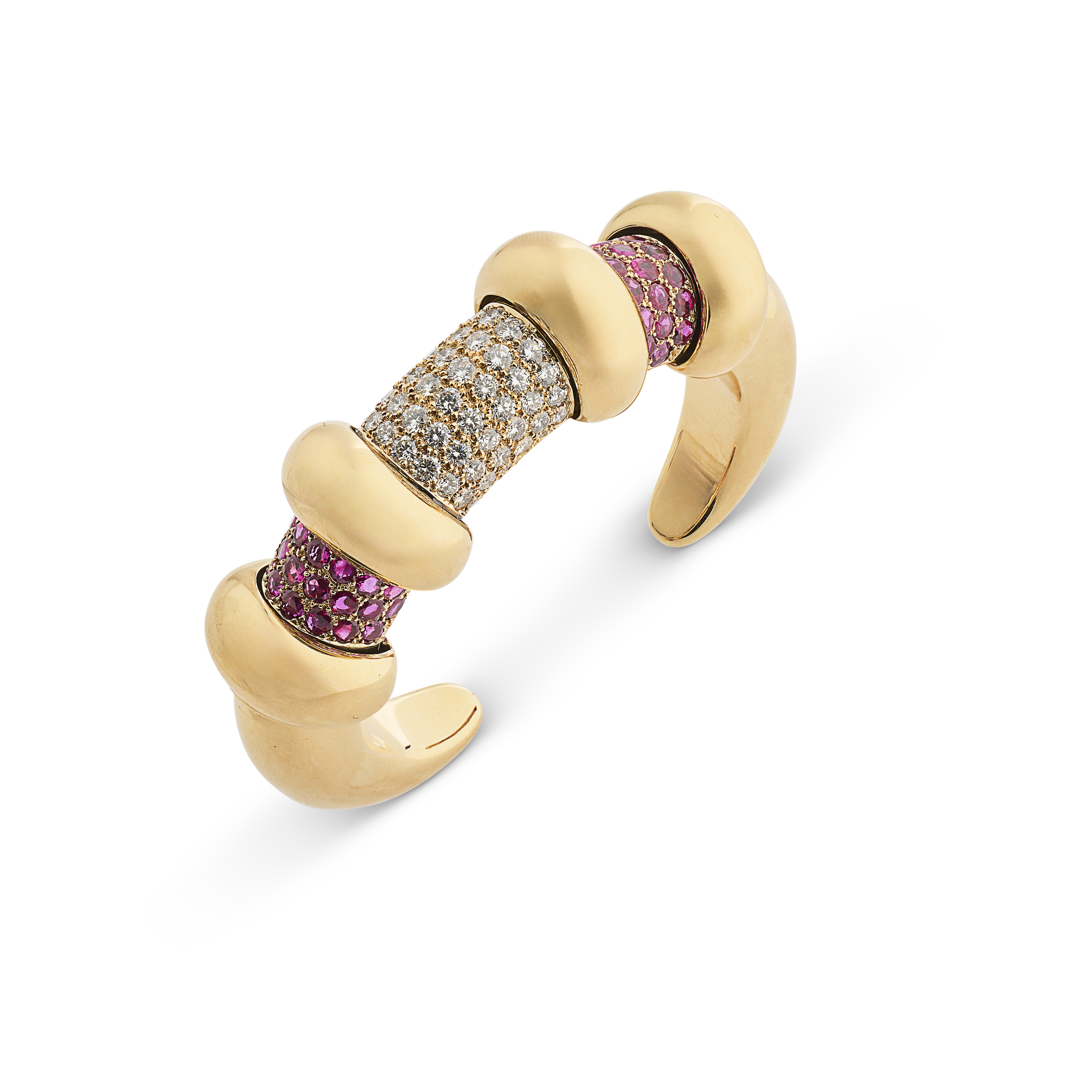 Rene Boivin. A ruby and diamond Cachettes bracelet. The gold panels slide to reveal either silver panels or gemstones. Dated 1979, after a design by Marie-Caroline de Brosses, offered in Joaillerie Paris, until 27 June 2025 at Christie's Online