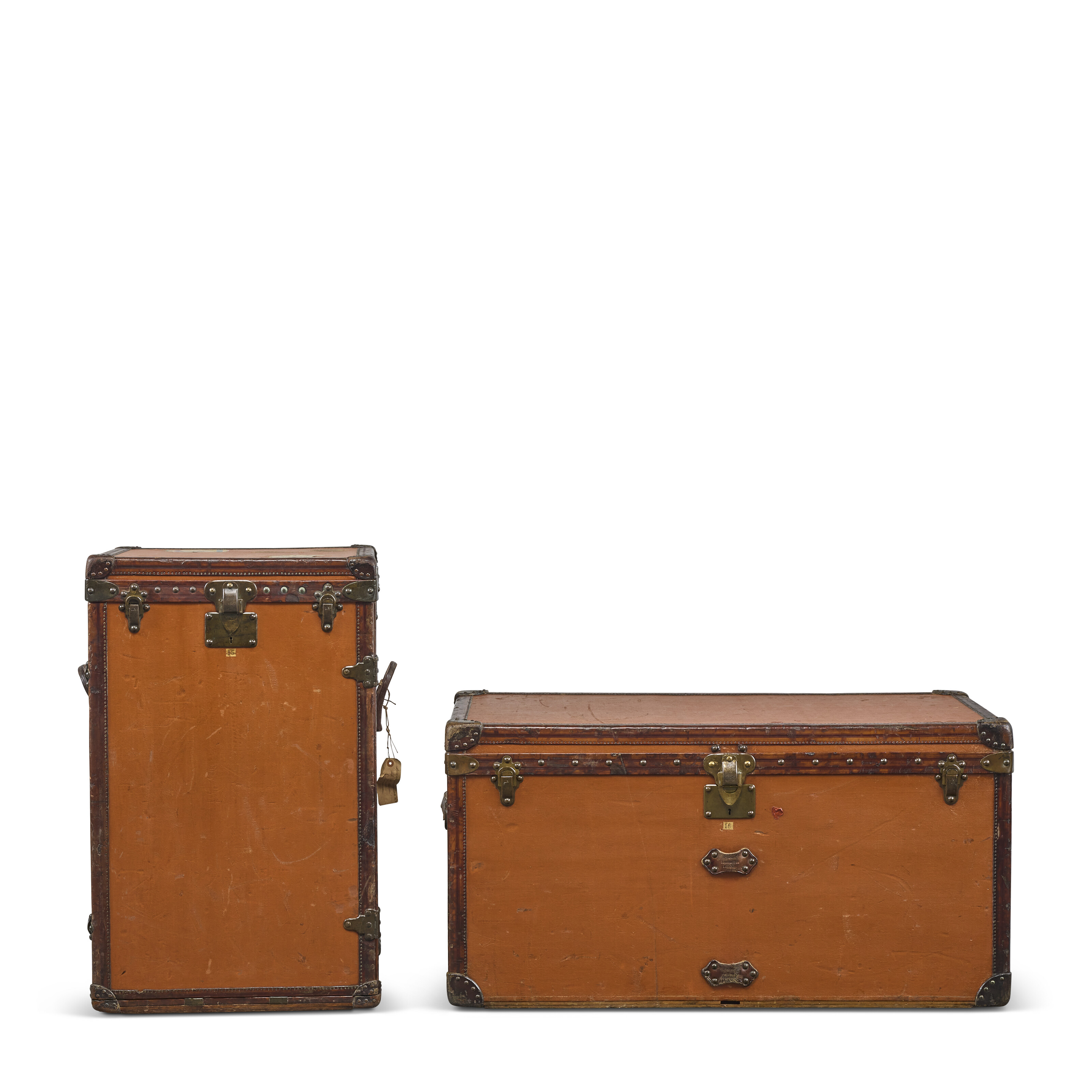 An orange Vuittonite canvas desk trunk for linen, and an orange Vuittonite canvas Low 110 trunk with brass hardware, Louis Vuitton, 1909, offered in Legendary Trunks: A European Private Collection Part II, until 1 July 2025 at Christie's Online
