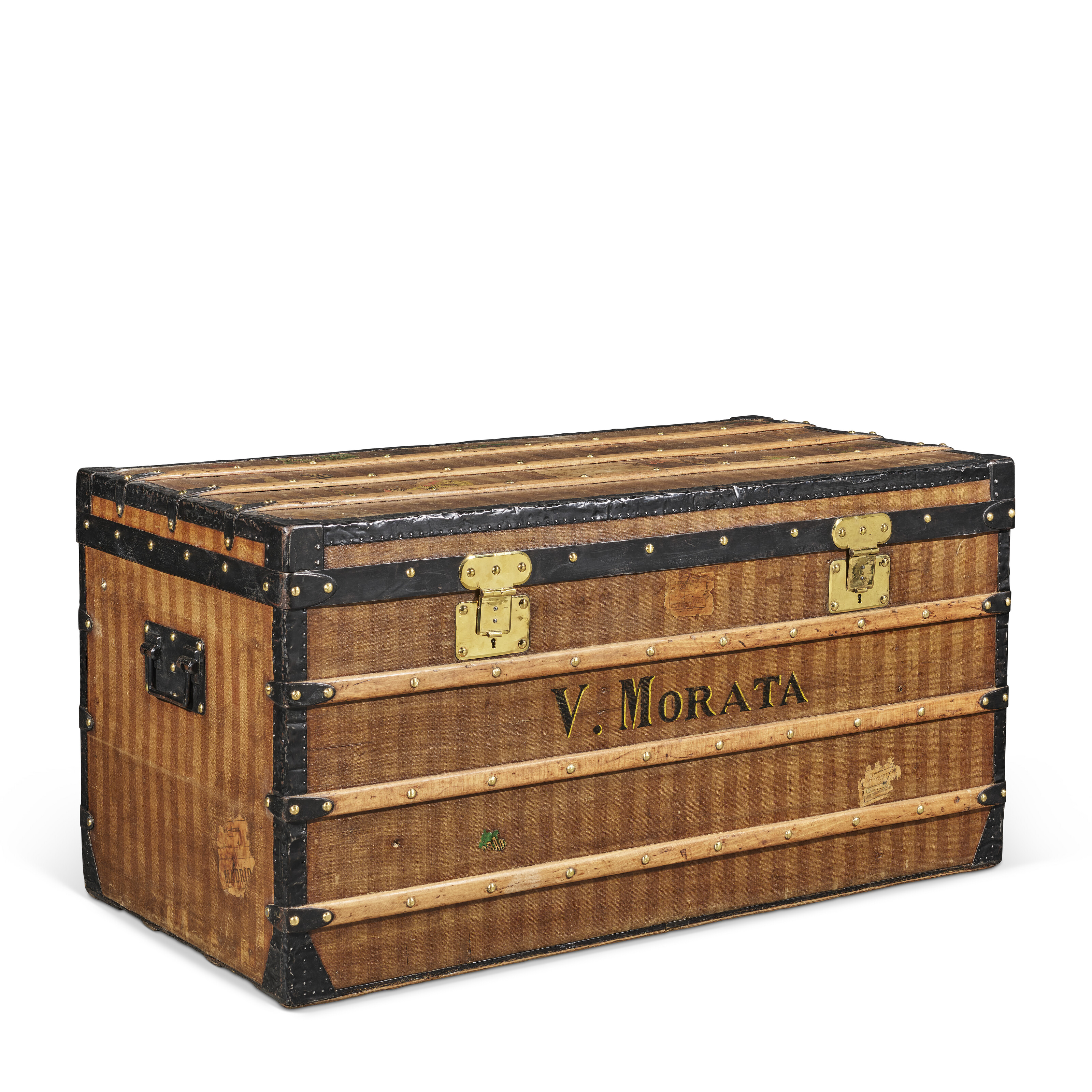 A brown and beige striped canvas Low 110 trunk with black lacquered iron and brass hardware, Louis Vuitton, 1882, offered in Legendary Trunks: A European Private Collection Part II, until 1 July 2025 at Christie's Online