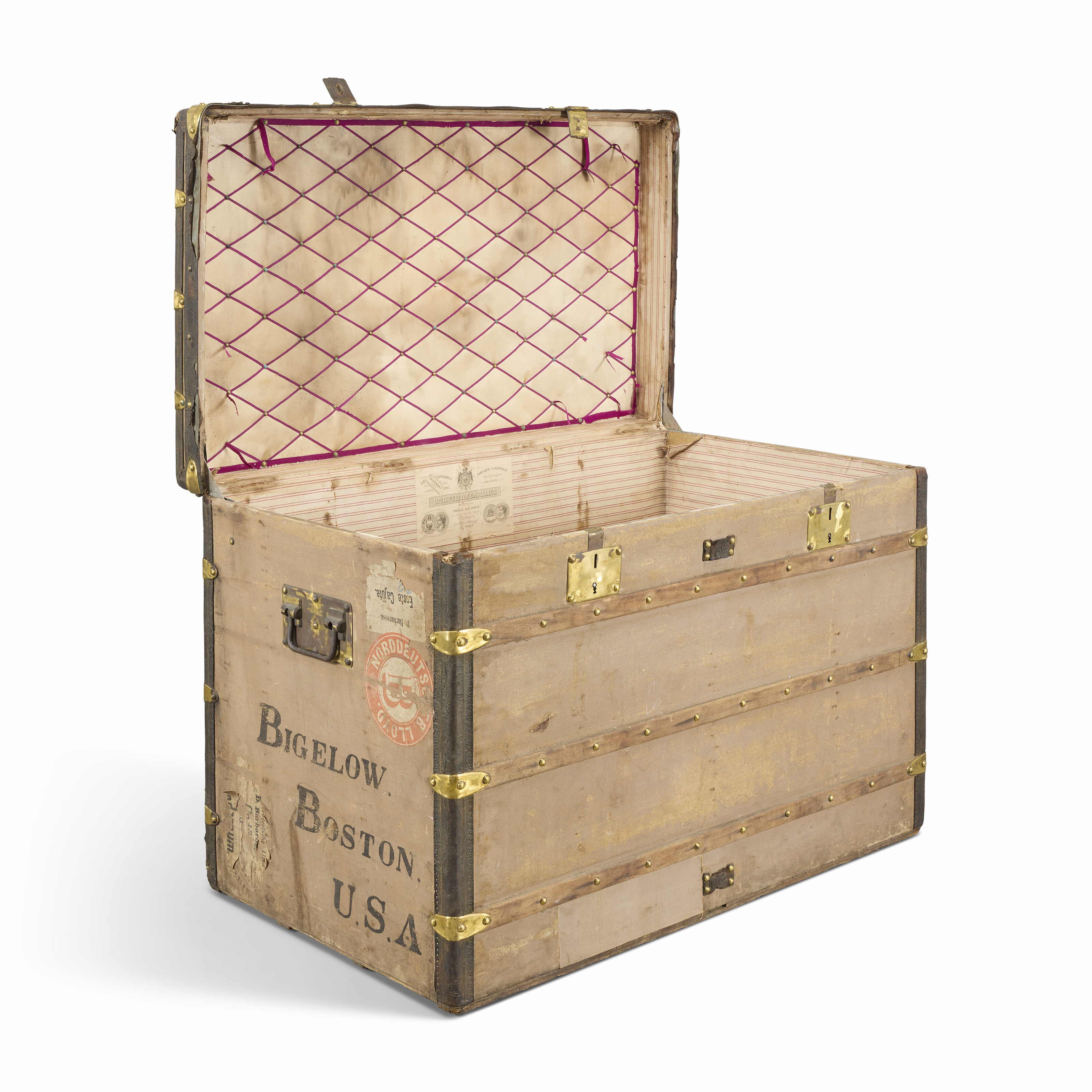 A GRIS TRIANON CANVAS TRUNK WITH BRASS HARDWARE