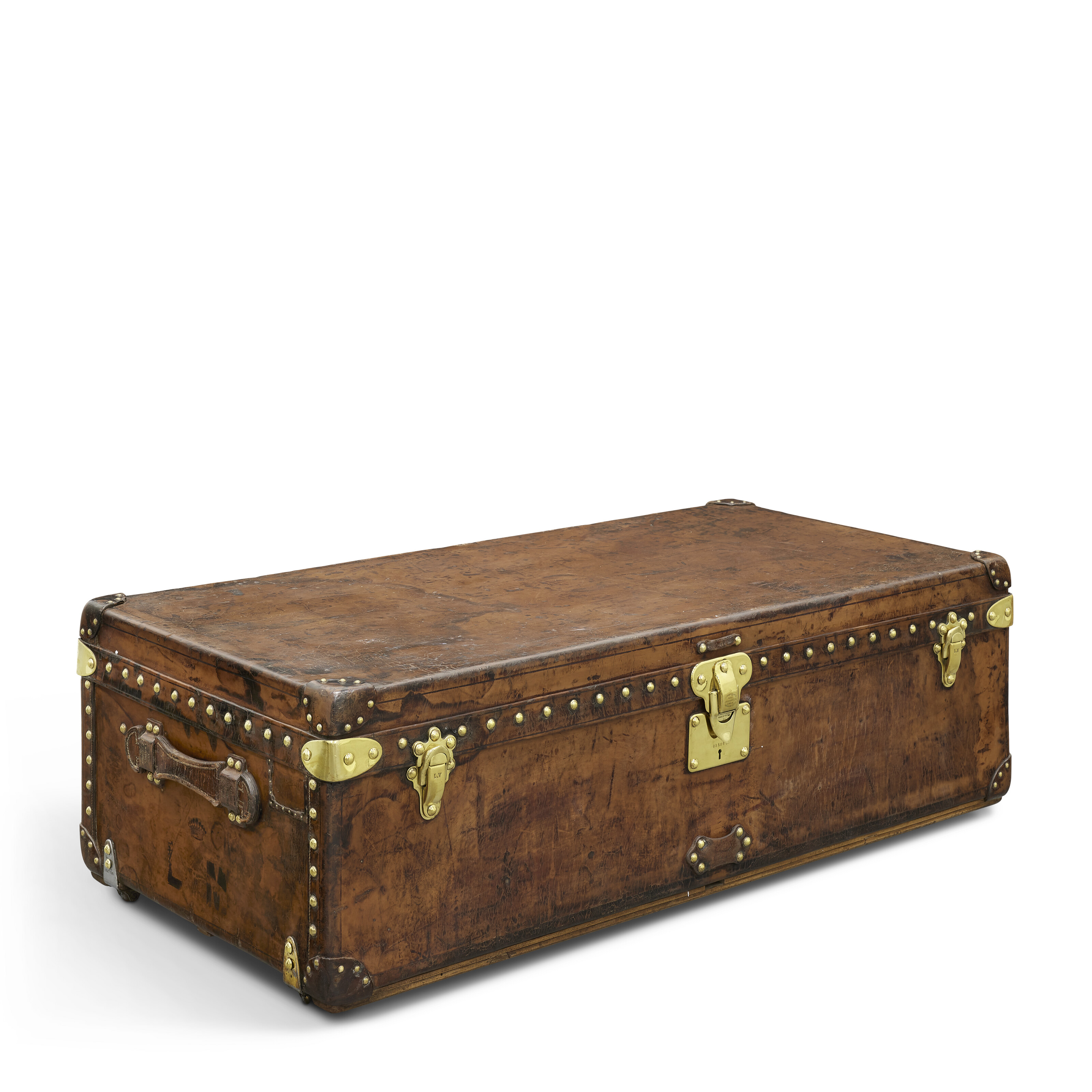 A NATURAL COWHIDE LEATHER CABIN 110 TRUNK WITH BRASS HARDWARE