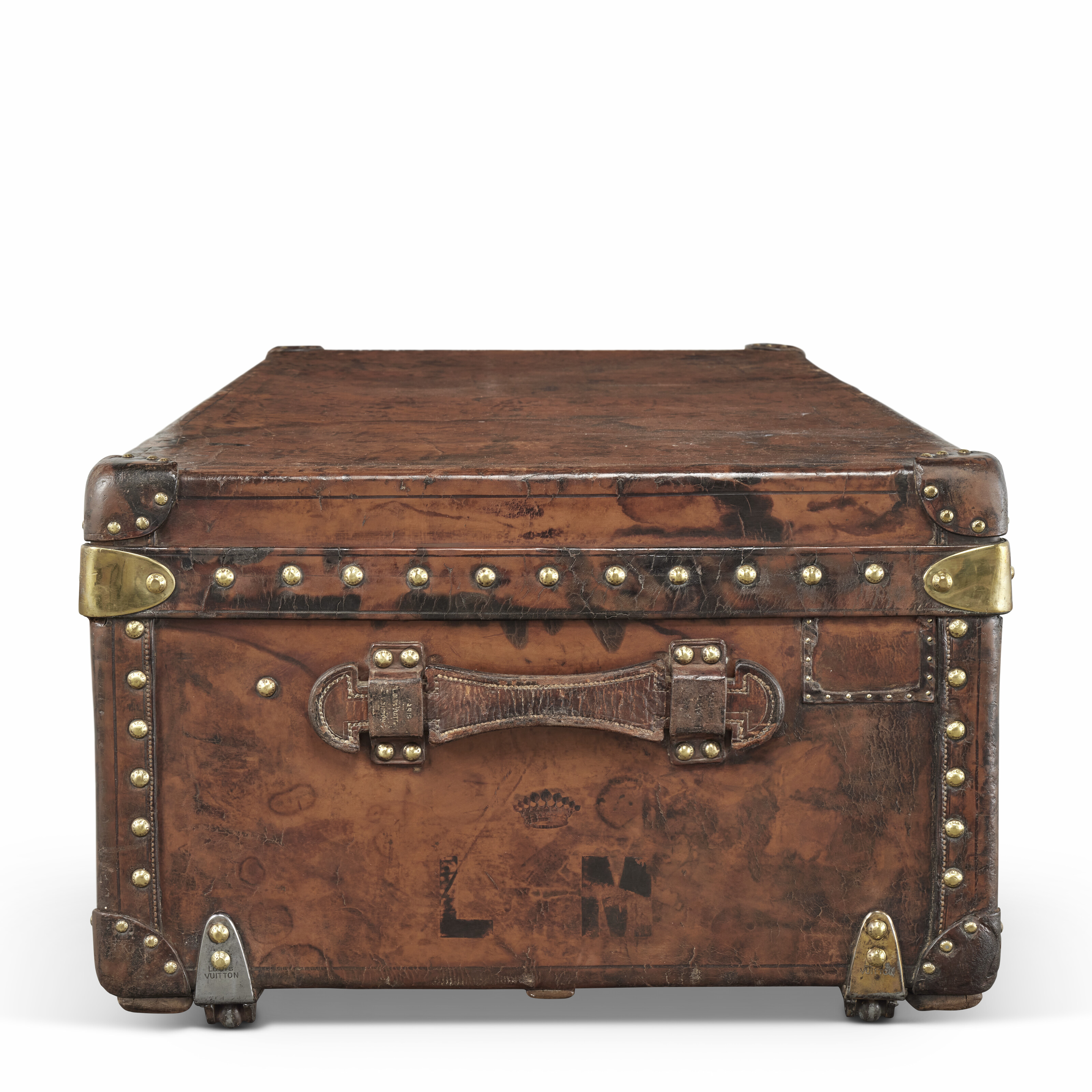 A NATURAL COWHIDE LEATHER CABIN 110 TRUNK WITH BRASS HARDWARE