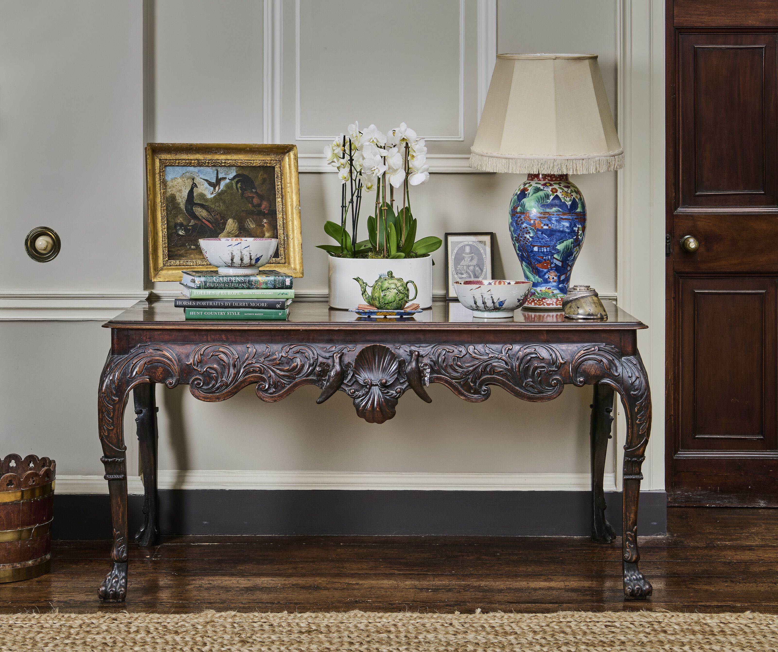 The Saloon: an Irish George II mahogany side table with a pair of 18th-century Chinese export famille rose bowls painted with British galleons and peonies. Both offered in Collections: Including Ardbraccan House, Ireland and a Sicilian Palazzo, until 15 April 2026 at Christie's Online