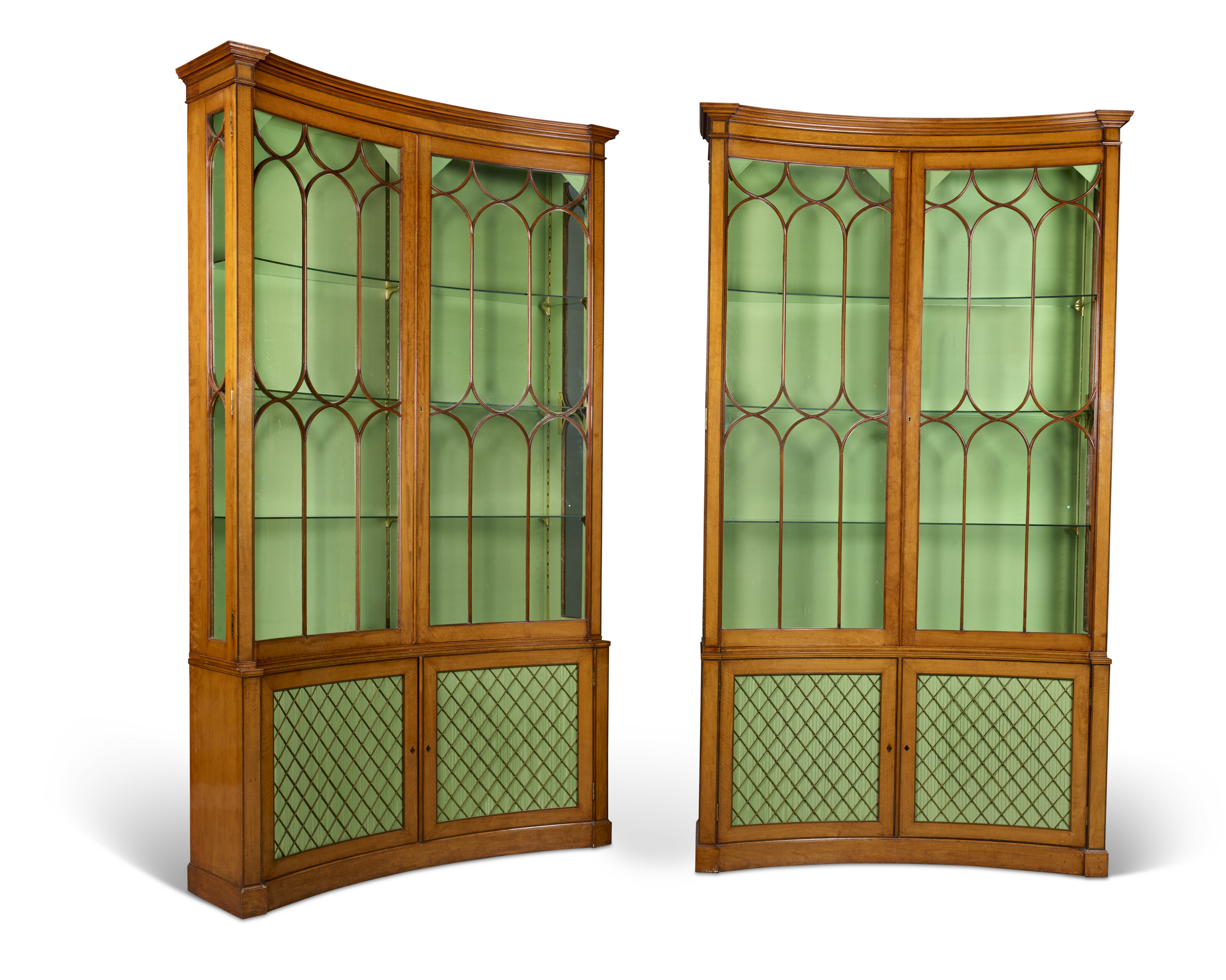A PAIR OF GEORGE III SATINWOOD CONCAVE BOOKCASES