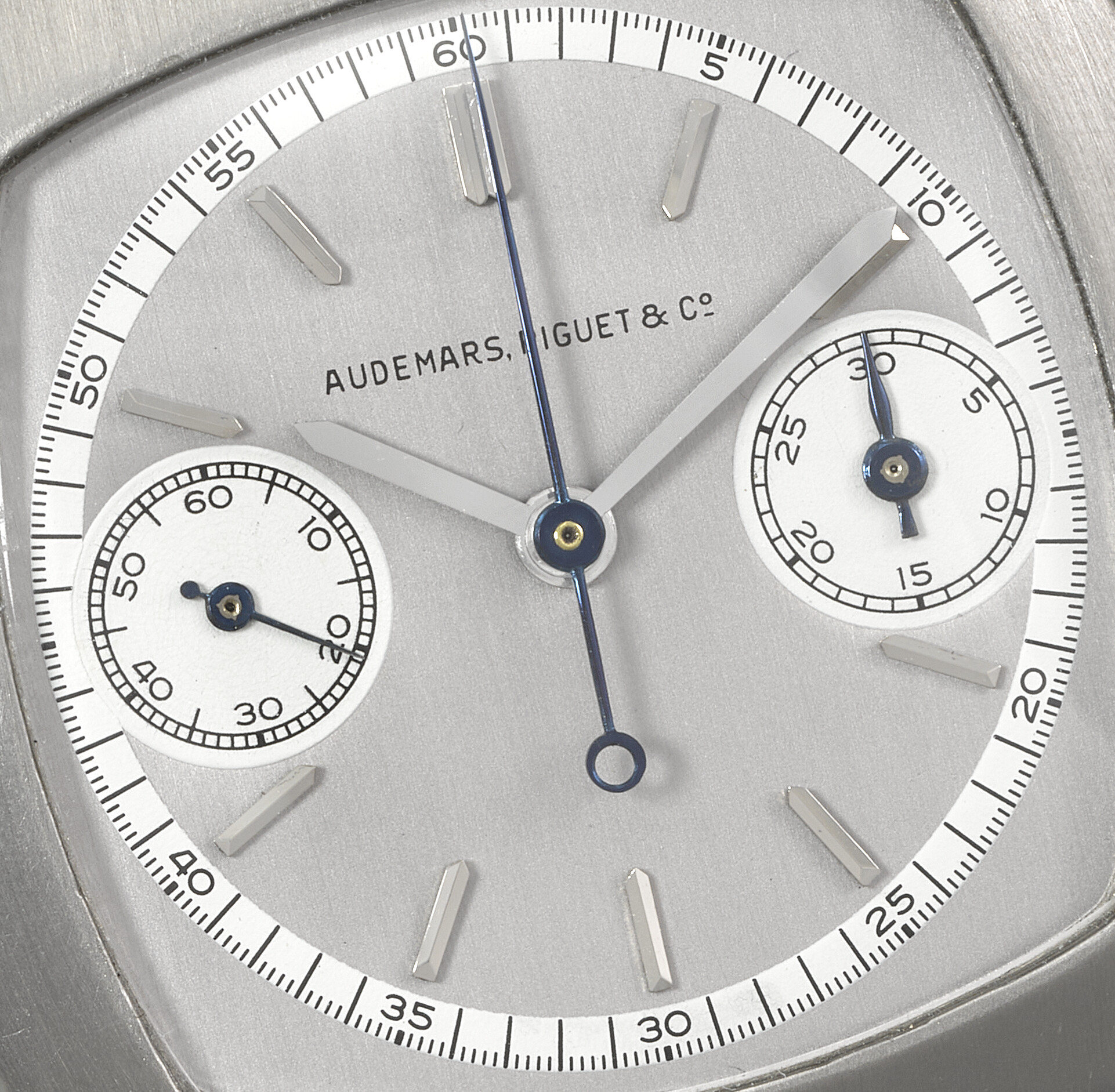The Art Deco design of this early monopusher chronograph is beautifully clean and minimalist, with the start, stop and return-to-zero functions all operated by pressing the winding crown. The brushed-platinum cushion case by Wenger, one of the greatest of the Genevan casemakers, perfectly frames the two-tone grey and white dial