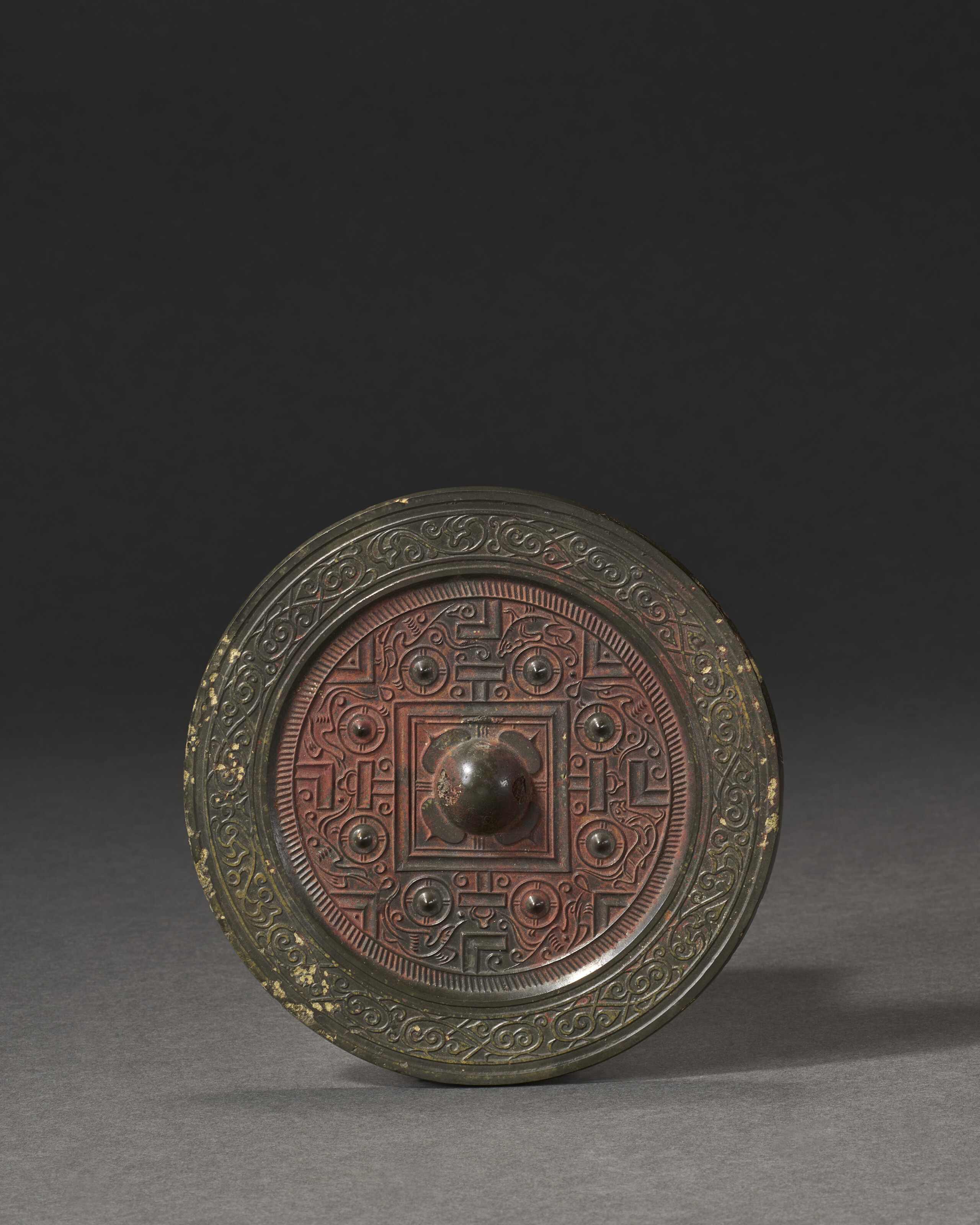 A SMALL BRONZE CIRCULAR 'TLV' MIRROR, CHINA, HAN DYNASTY (206 BC-AD 220 ...