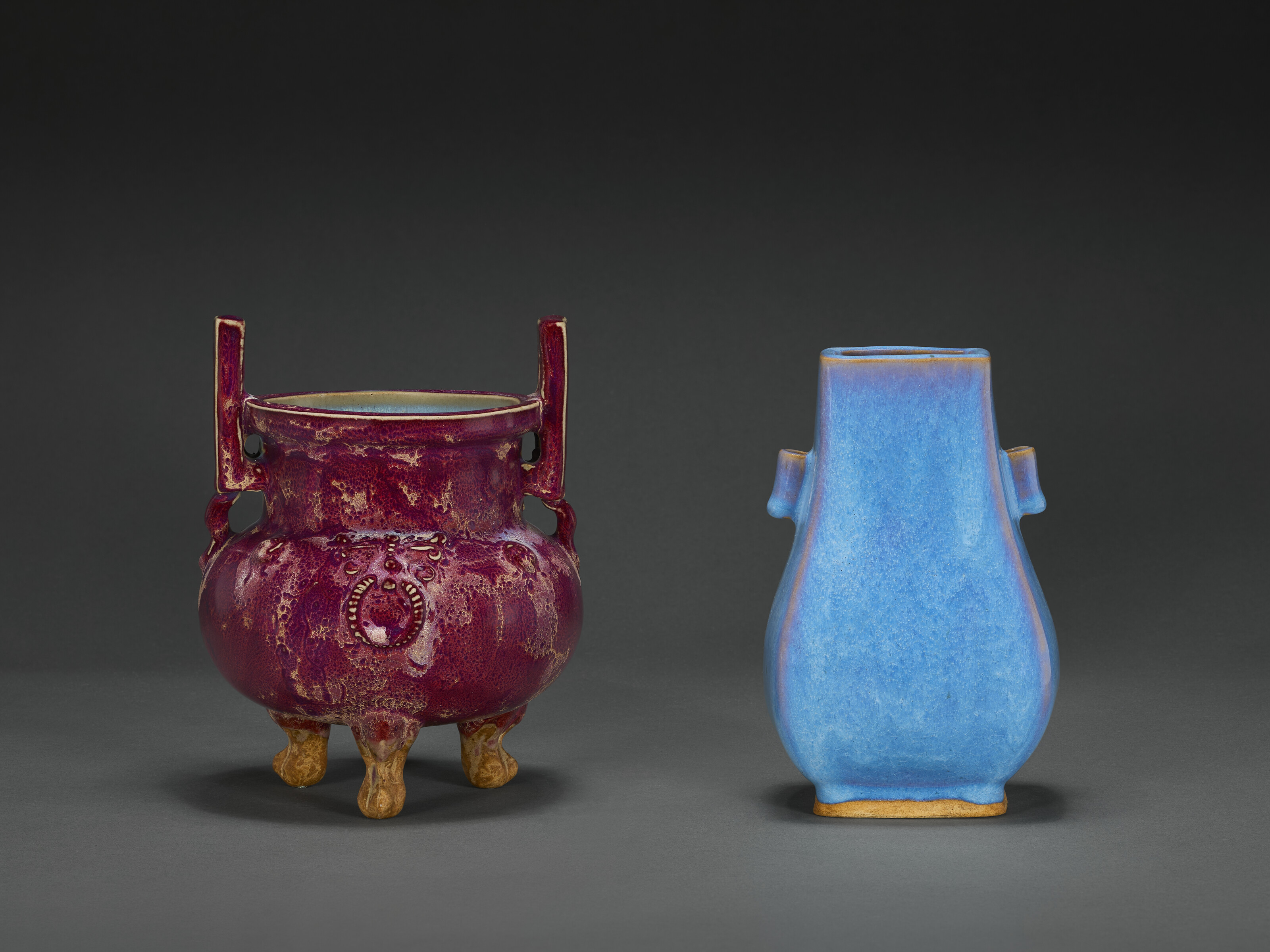 A PURPLE-SPLASHED JUN-TYPE TRIPOD CENSER AND A BLUE-GLAZED HU-FORM VASE ...