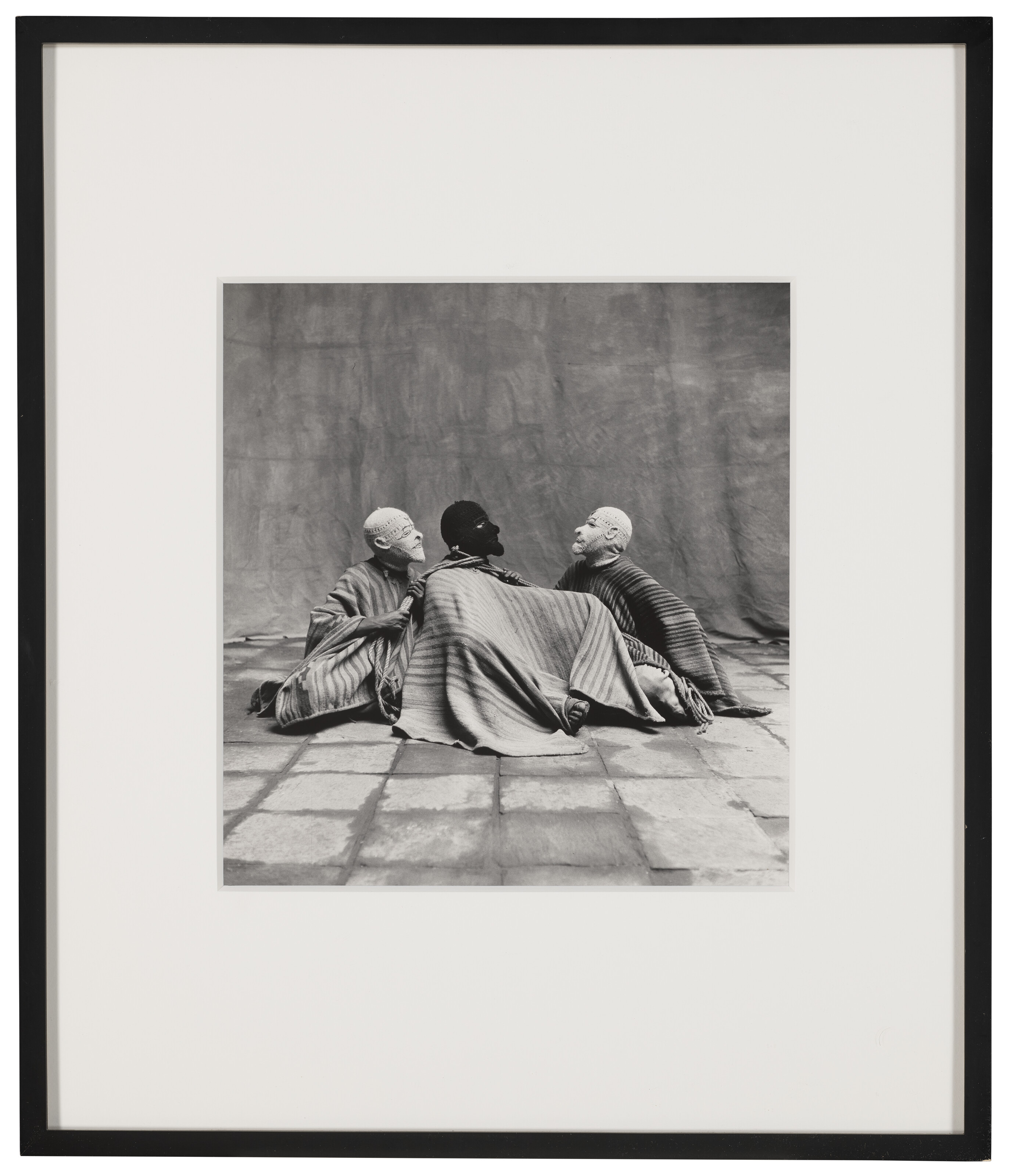 IRVING PENN (1917–2009), Three Sitting Men in Masks, Cuzuco, 1948
