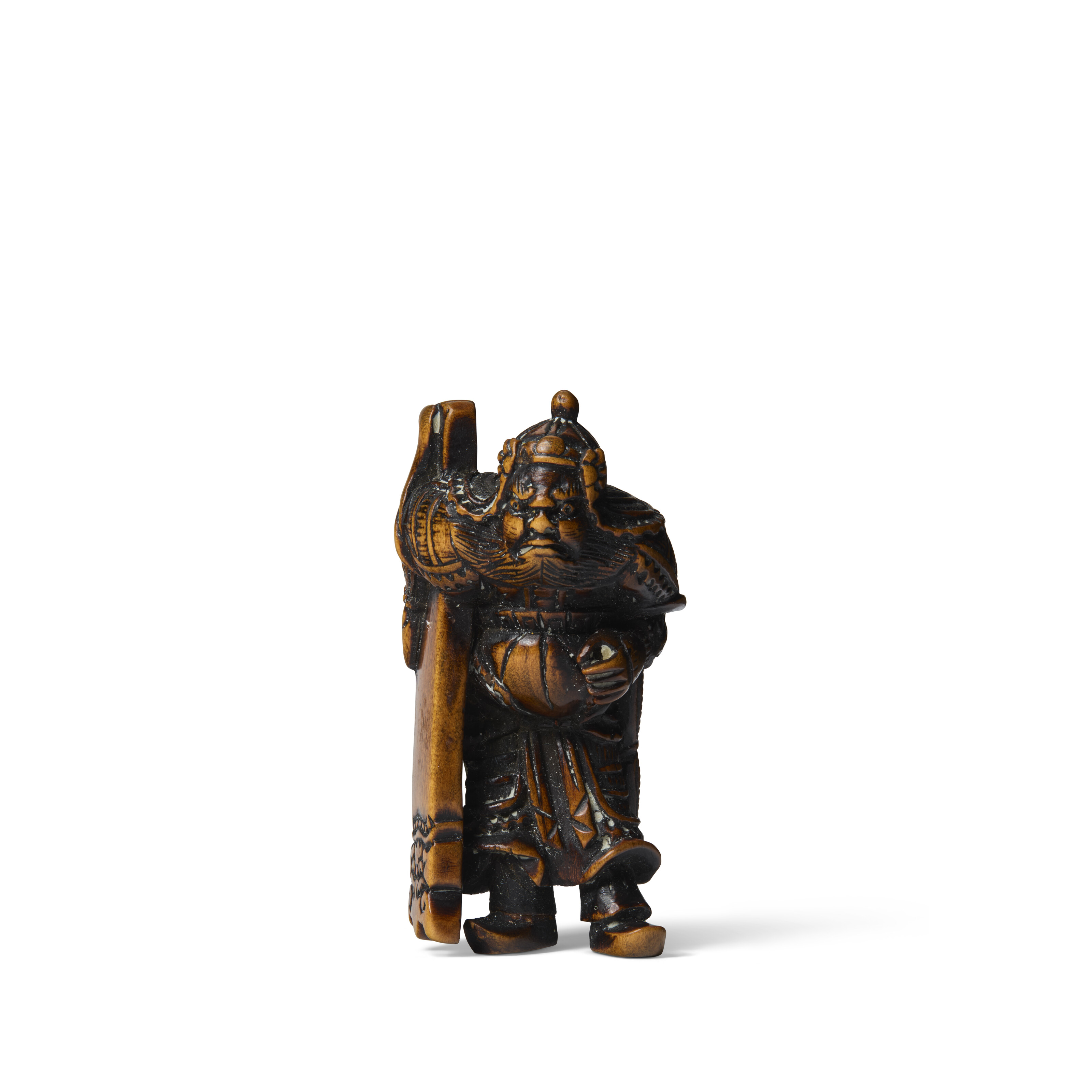 A CARVED WOOD NETSUKE OF HAN KAI (FAN KUAI) CARRYING A SHIELD, EDO