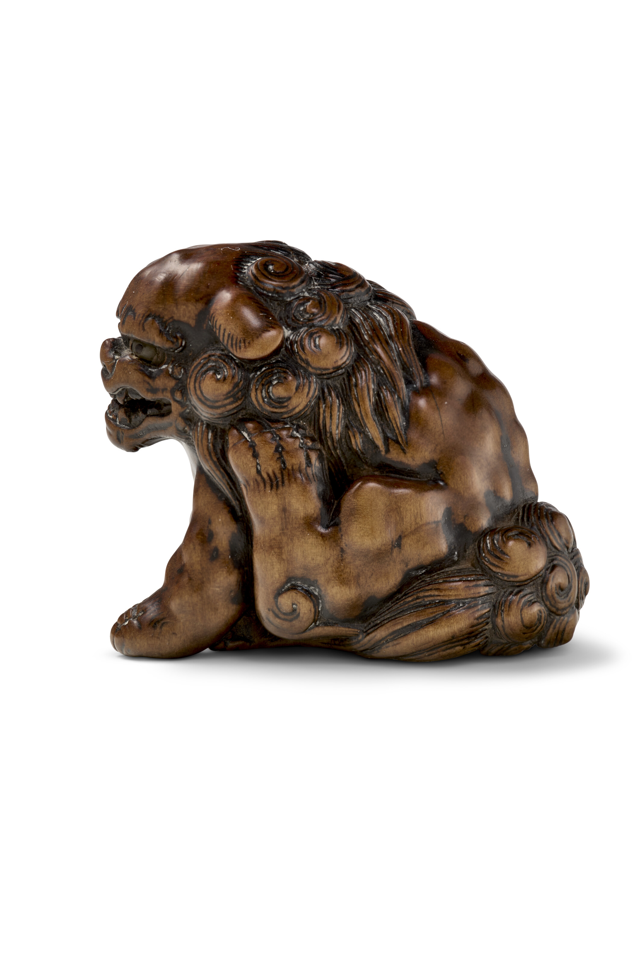 A CARVED WOOD NETSUKE OF A SHISHI (LION-DOG), EDO PERIOD (18TH