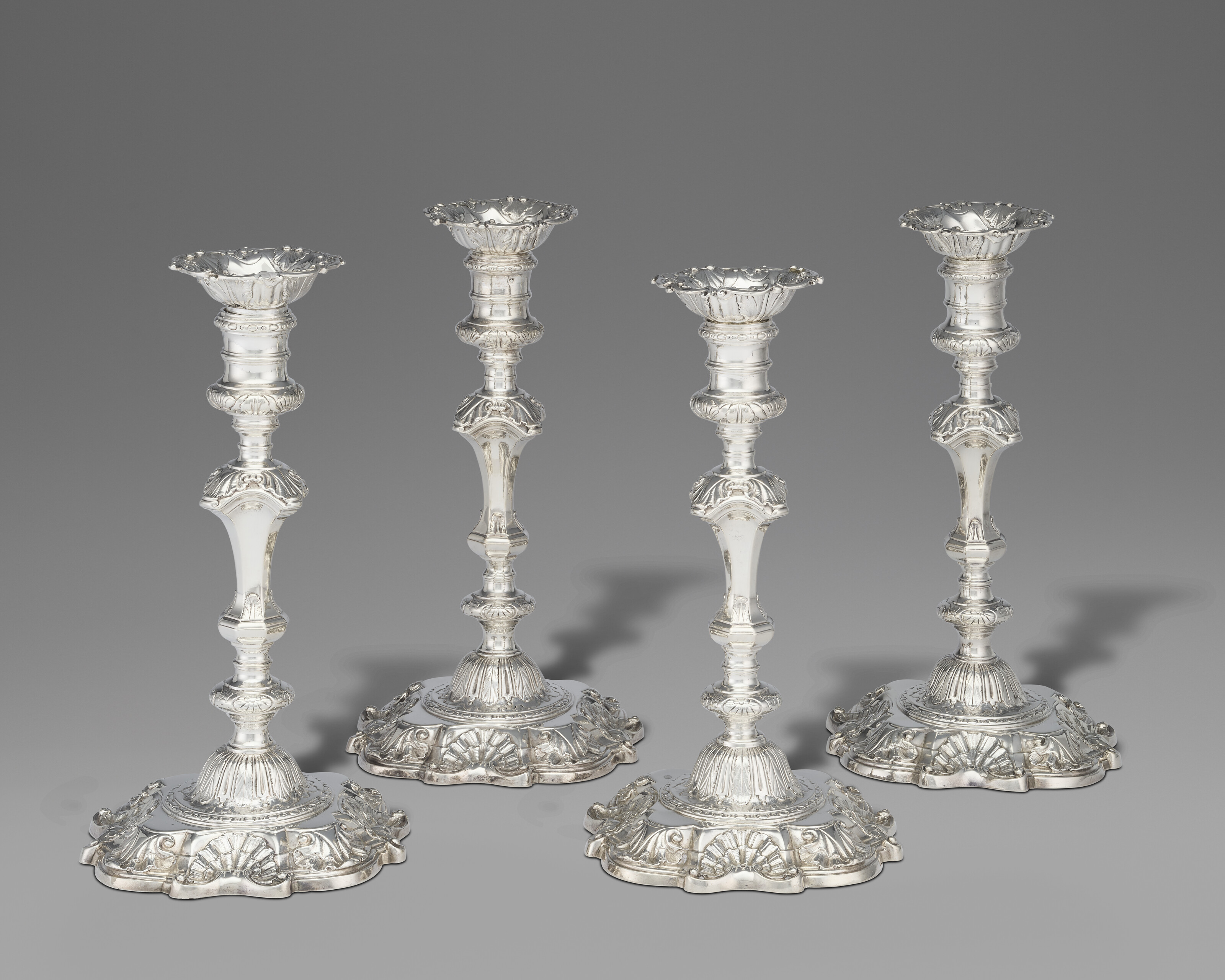 A SET OF FOUR GEORGE II SILVER CANDLESTICKS, MARK OF CHARLES