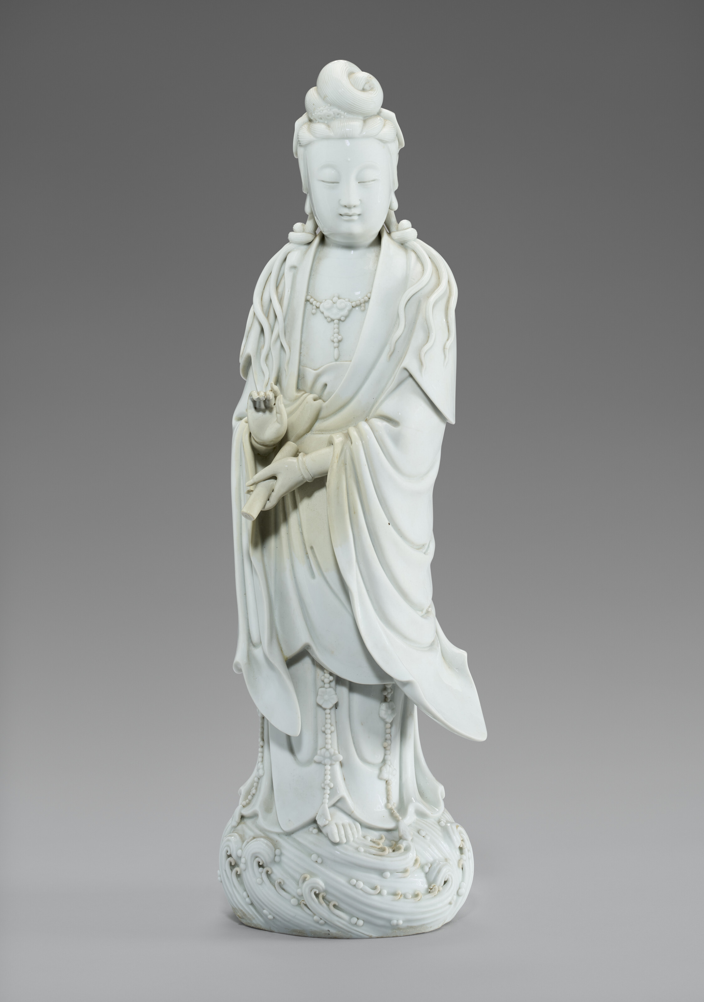 A LARGE DEHUA FIGURE OF STANDING GUANYIN