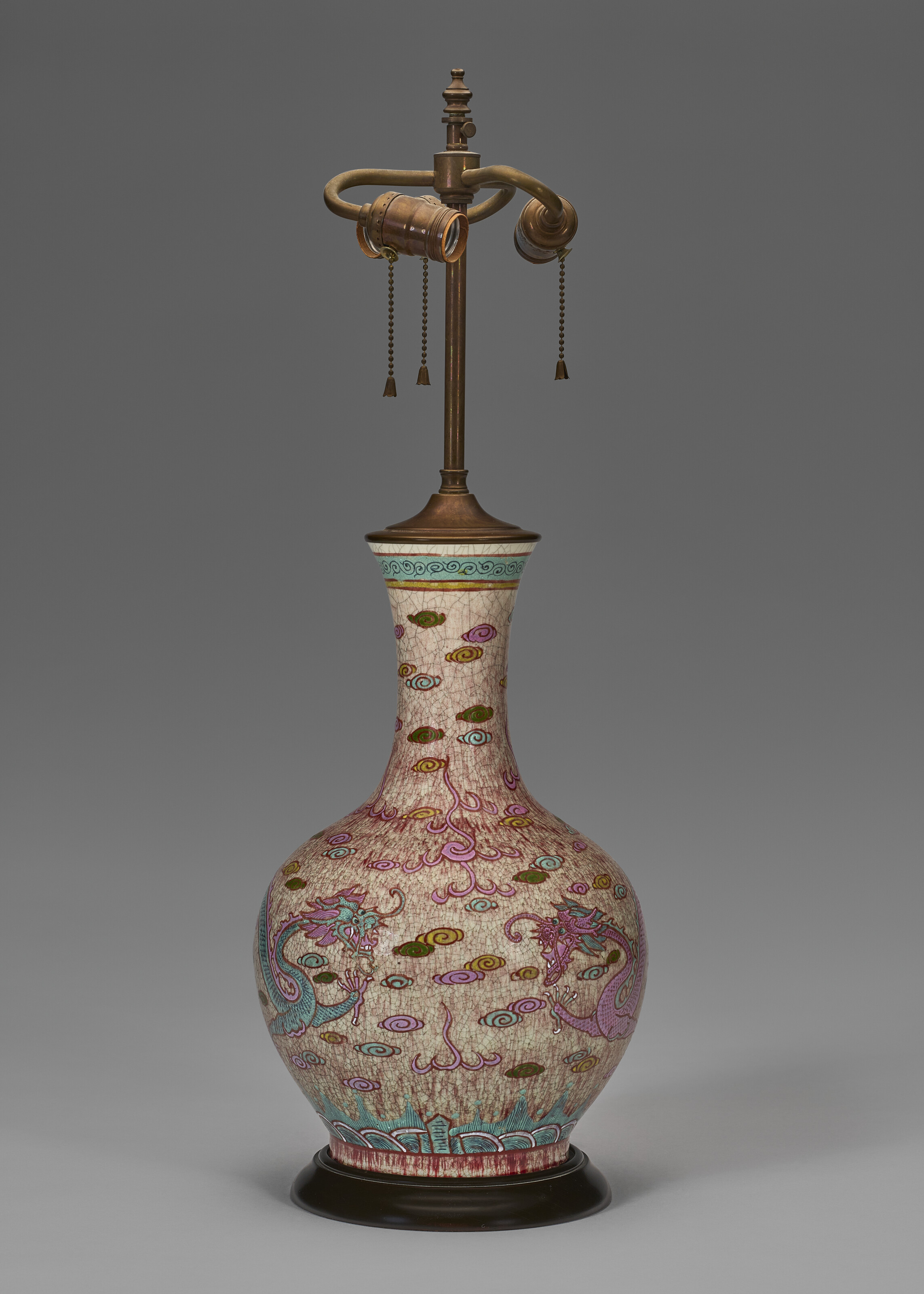 A FAMILLE ROSE-DECORATED COPPER-RED-GLAZED BOTTLE VASE MOUNTED AS A LAMP