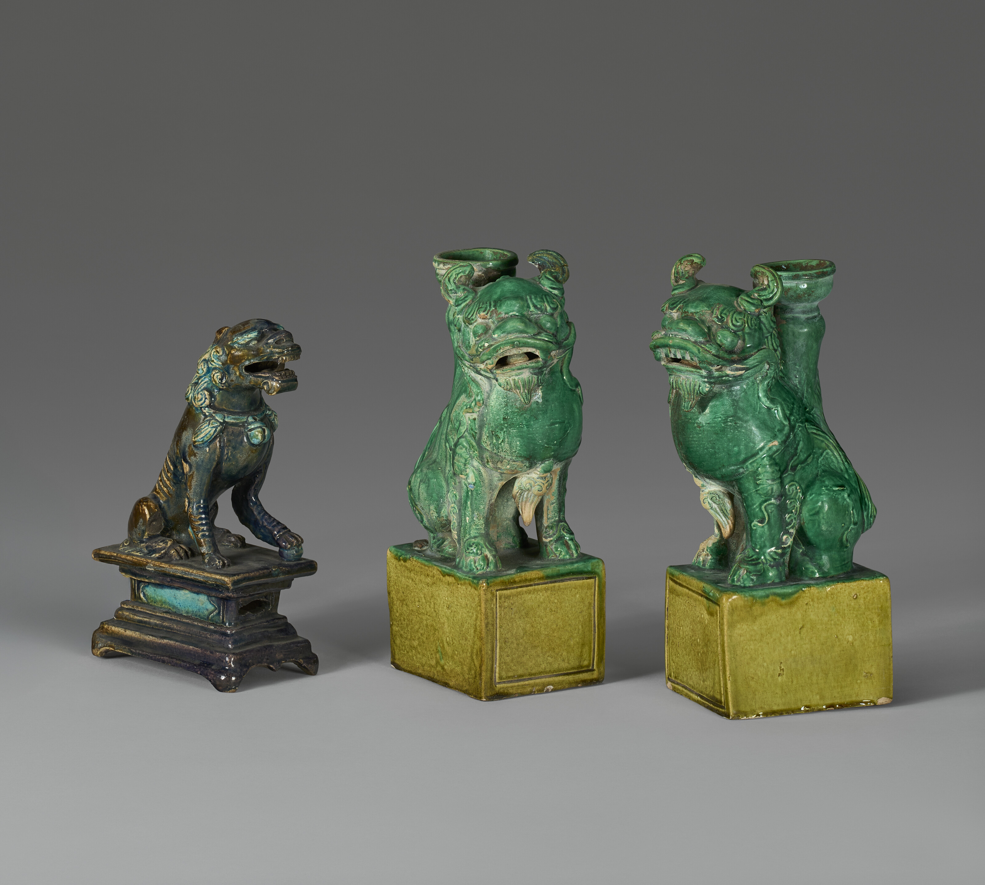 THREE GLAZED 'BUDDHIST LIONS' TILEWORKS FIGURES