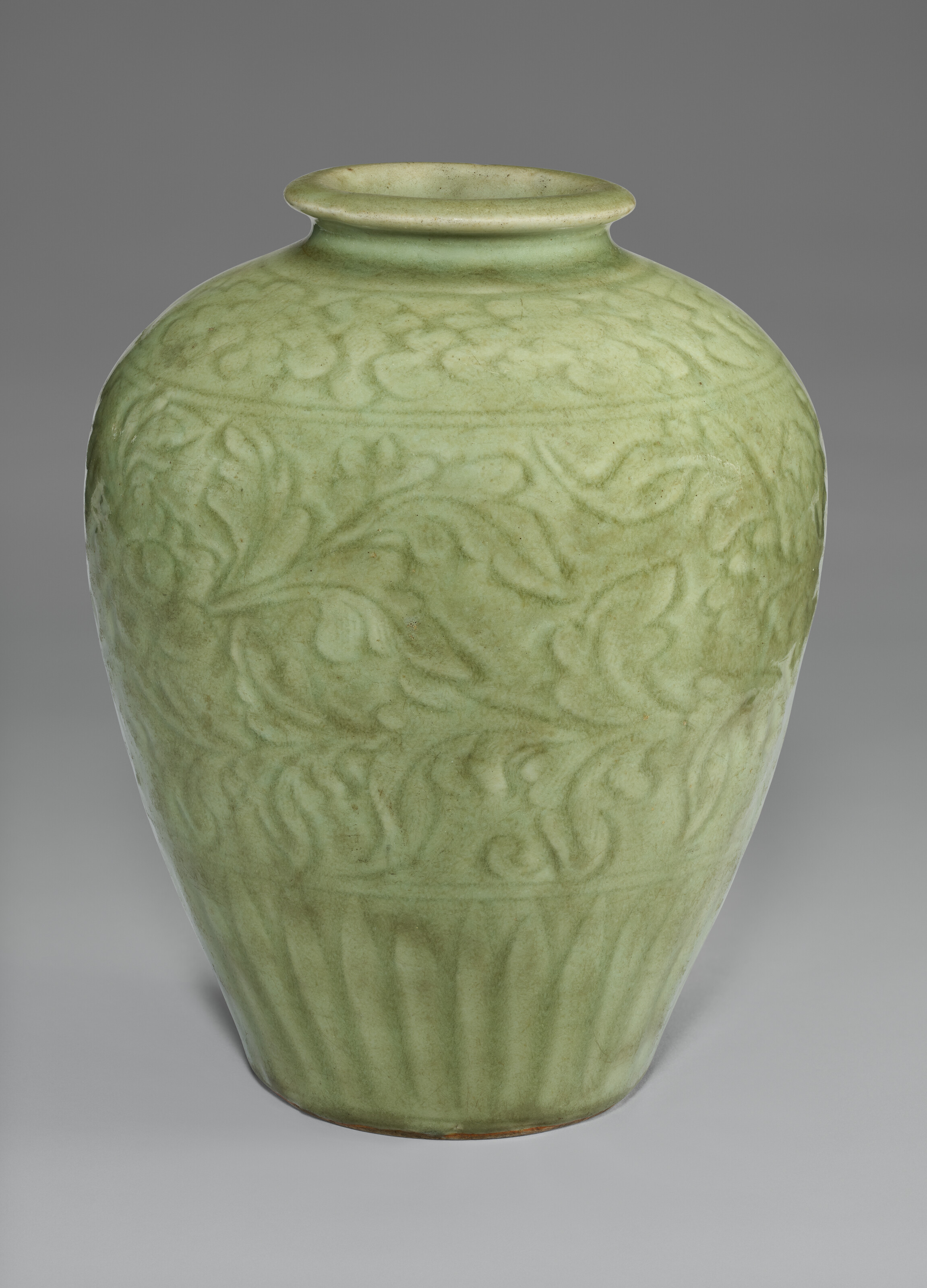 A CARVED LONGQUAN CELADON JAR
