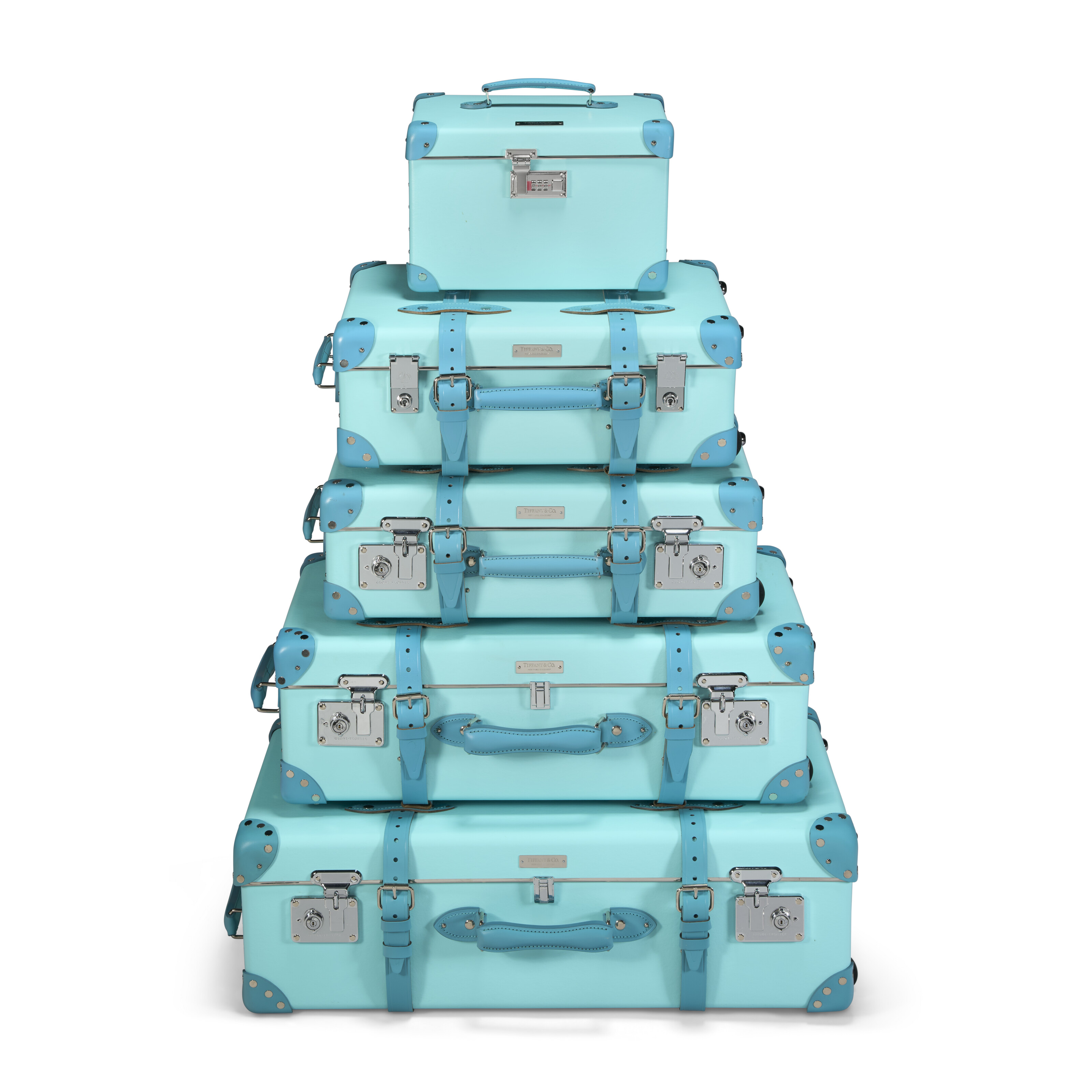 A SET OF FIVE: LIMITED EDITION TIFFANY BLUE VULCANISED FIBREBOARD TROLLEY SUITCASE TRUNKS