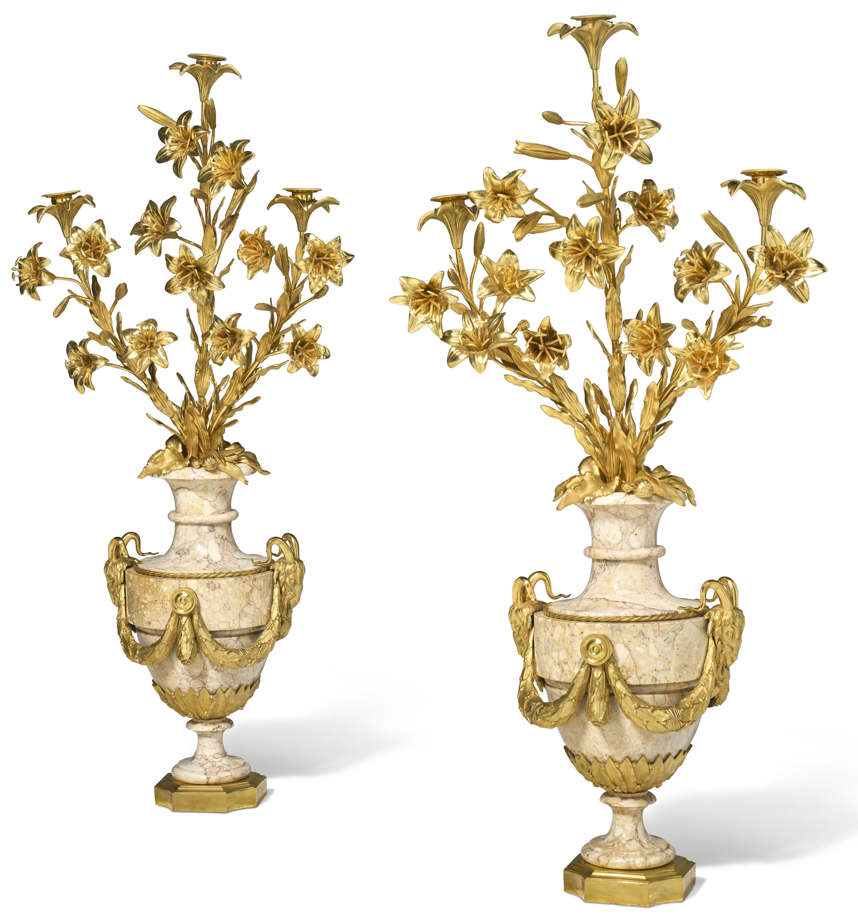 A PAIR OF LOUIS XVI ORMOLU AND PINK AND YELLOW-VEINED WHITE MARBLE THREE-LIGHT CANDELABRA