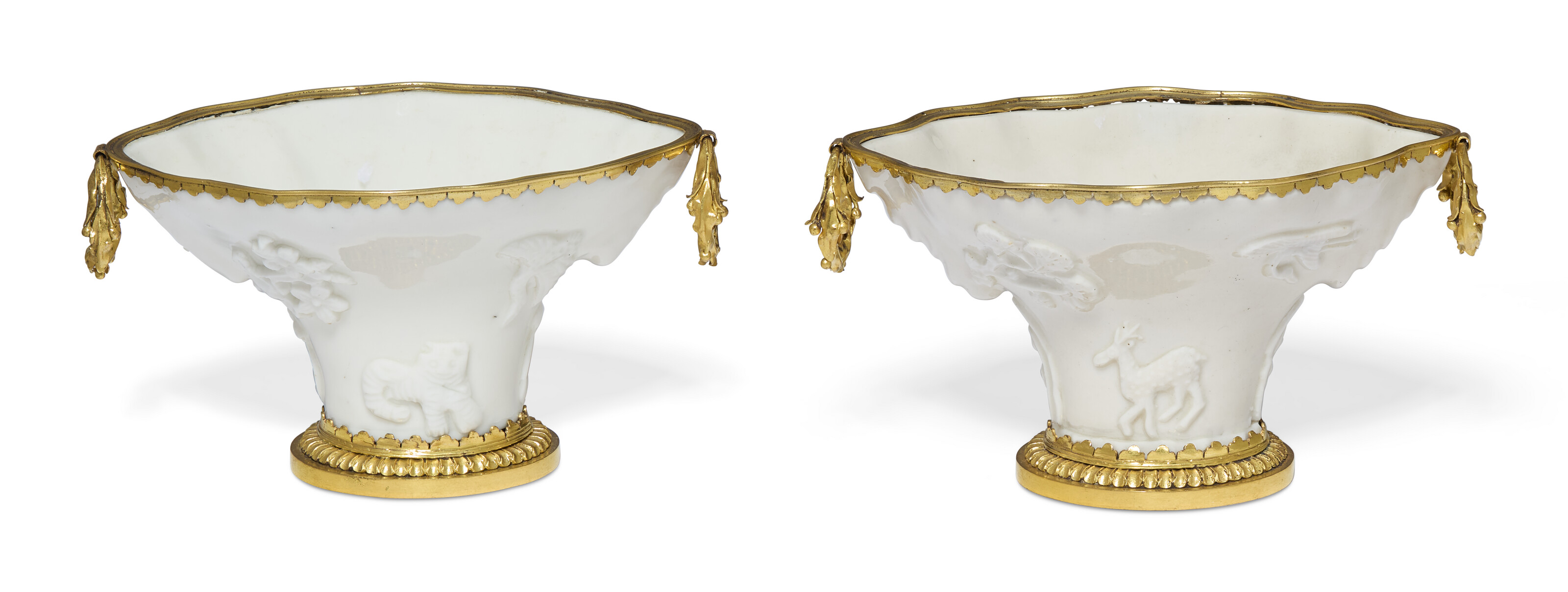 A PAIR OF FRENCH ORMOLU-MOUNTED CHINESE DEHUA PORCELAIN LIBATION CUPS