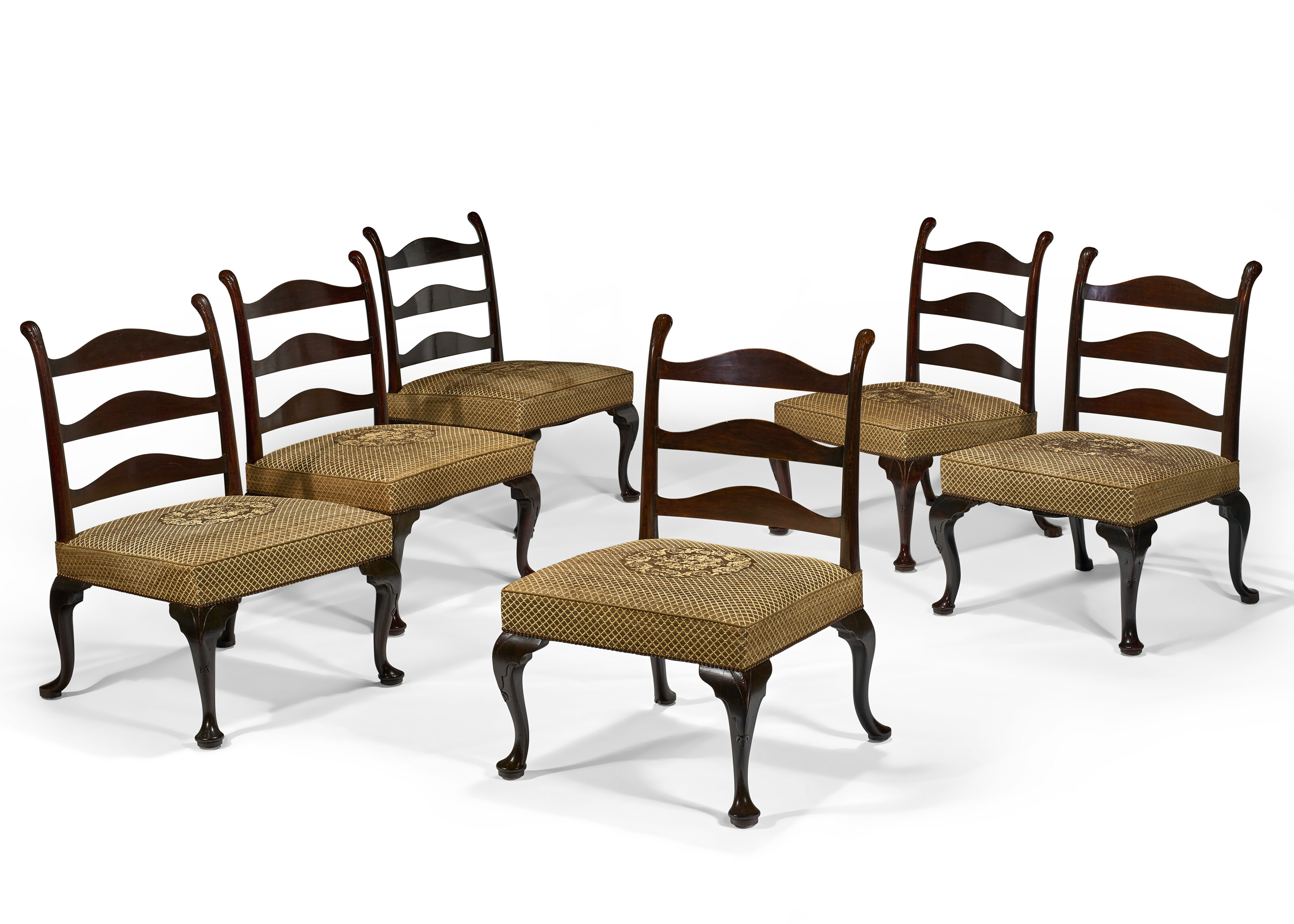 A SET OF SIX LARGE GEORGE III STAINED MAHOGANY LADDER-BACK SIDE CHAIRS