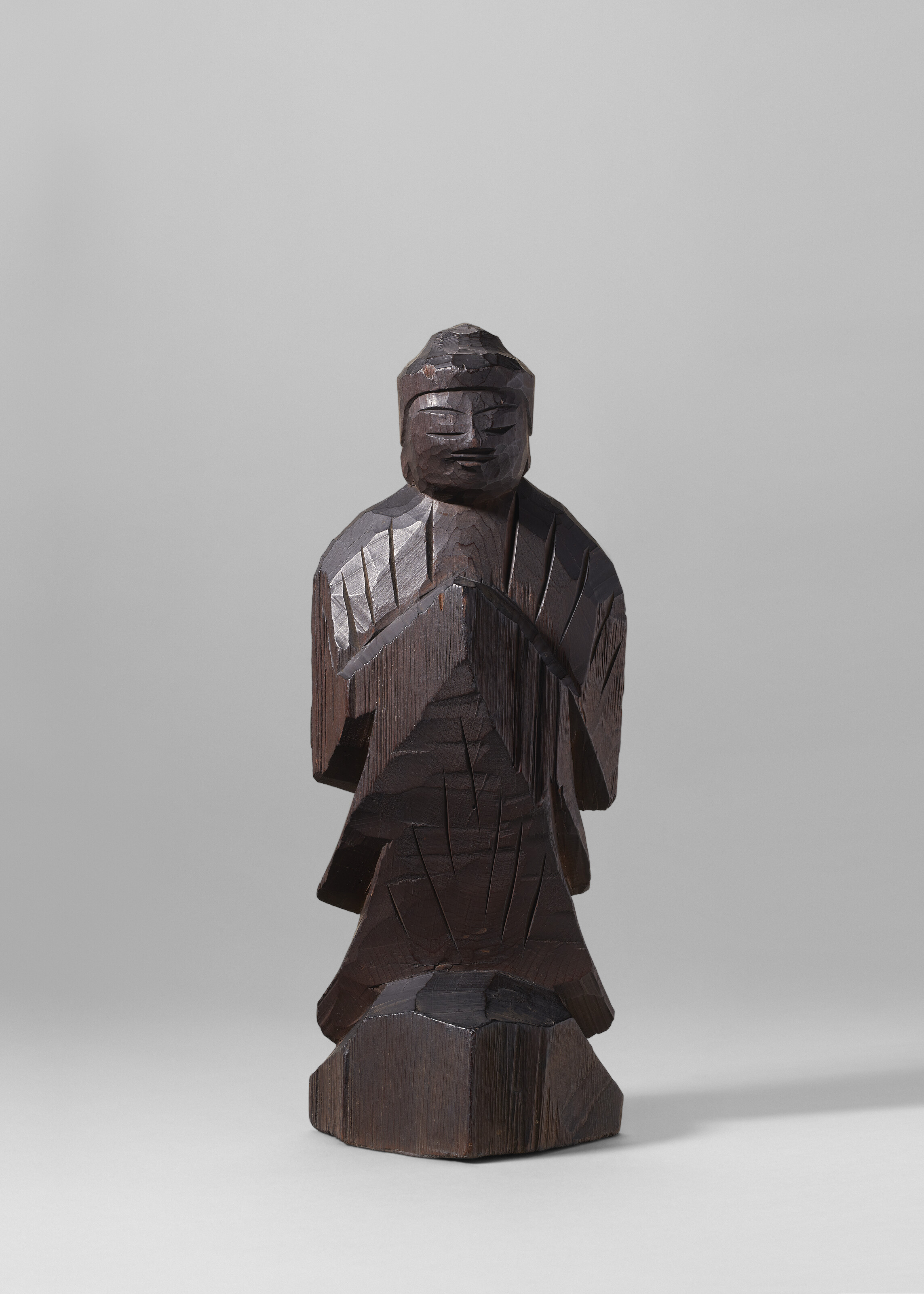 A CARVED WOOD MINIATURE SCULPTURE (NETSUKE) OF OCTOPUS AND MONKEYS
