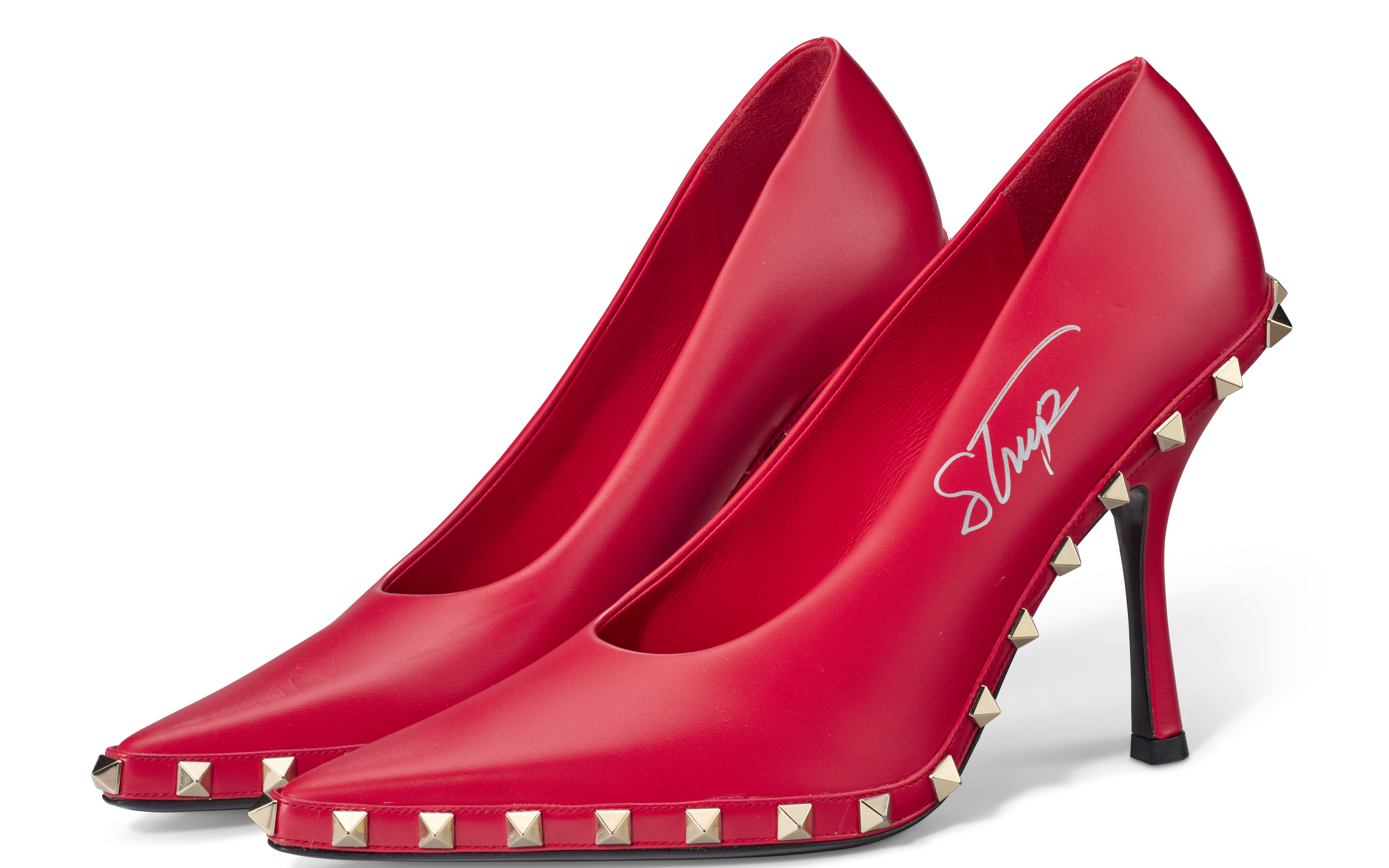 A PAIR OF RED ROCKSTUD PUMPS CREATED FOR THE TRAILER FOR THE DEVIL WEARS PRADA 2, SIGNED BY MERYL STREEP