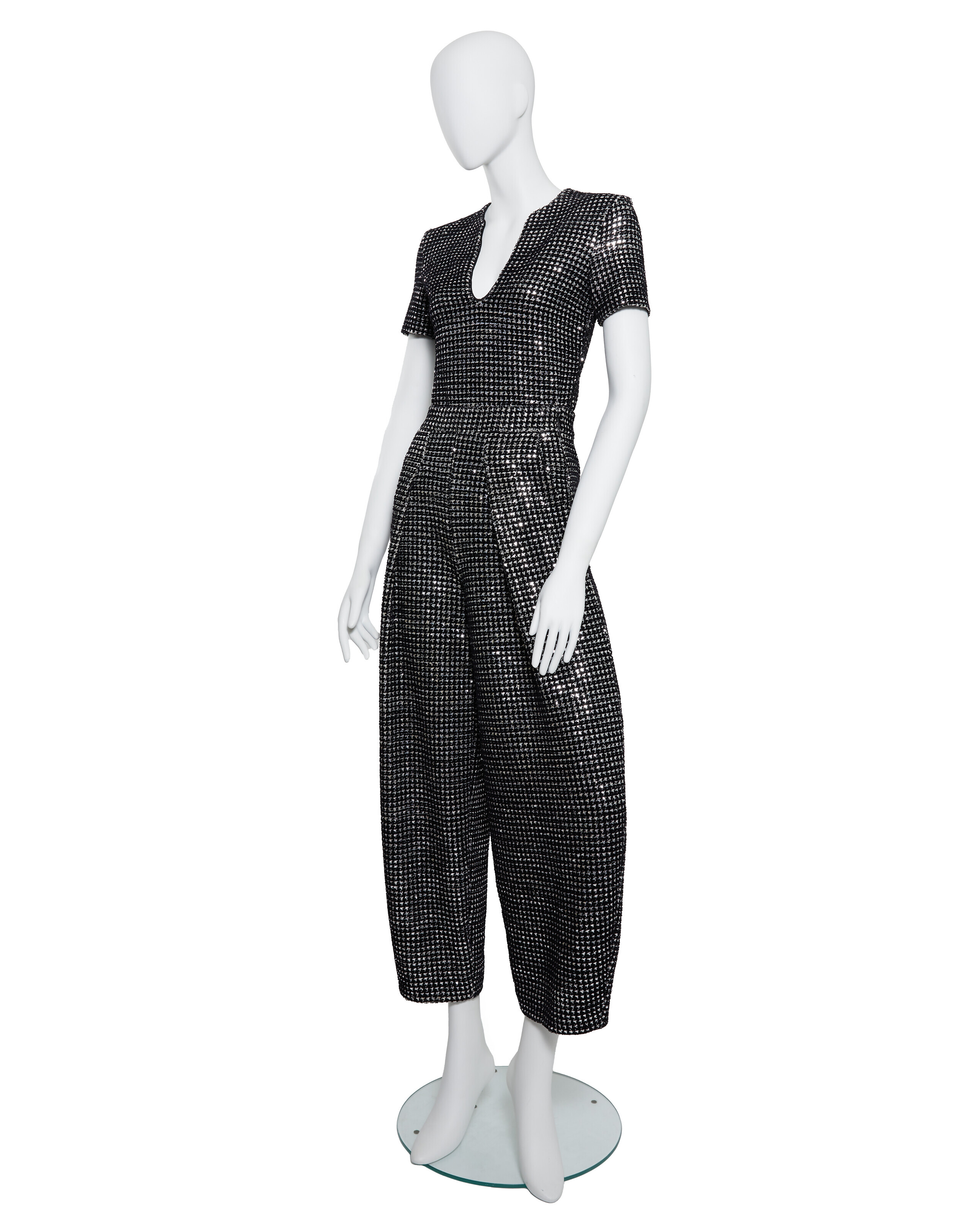 A BLACK SEQUIN TWEED BODYSUIT AND TROUSER SET, SCREEN WORN BY ANNE HATHAWAY