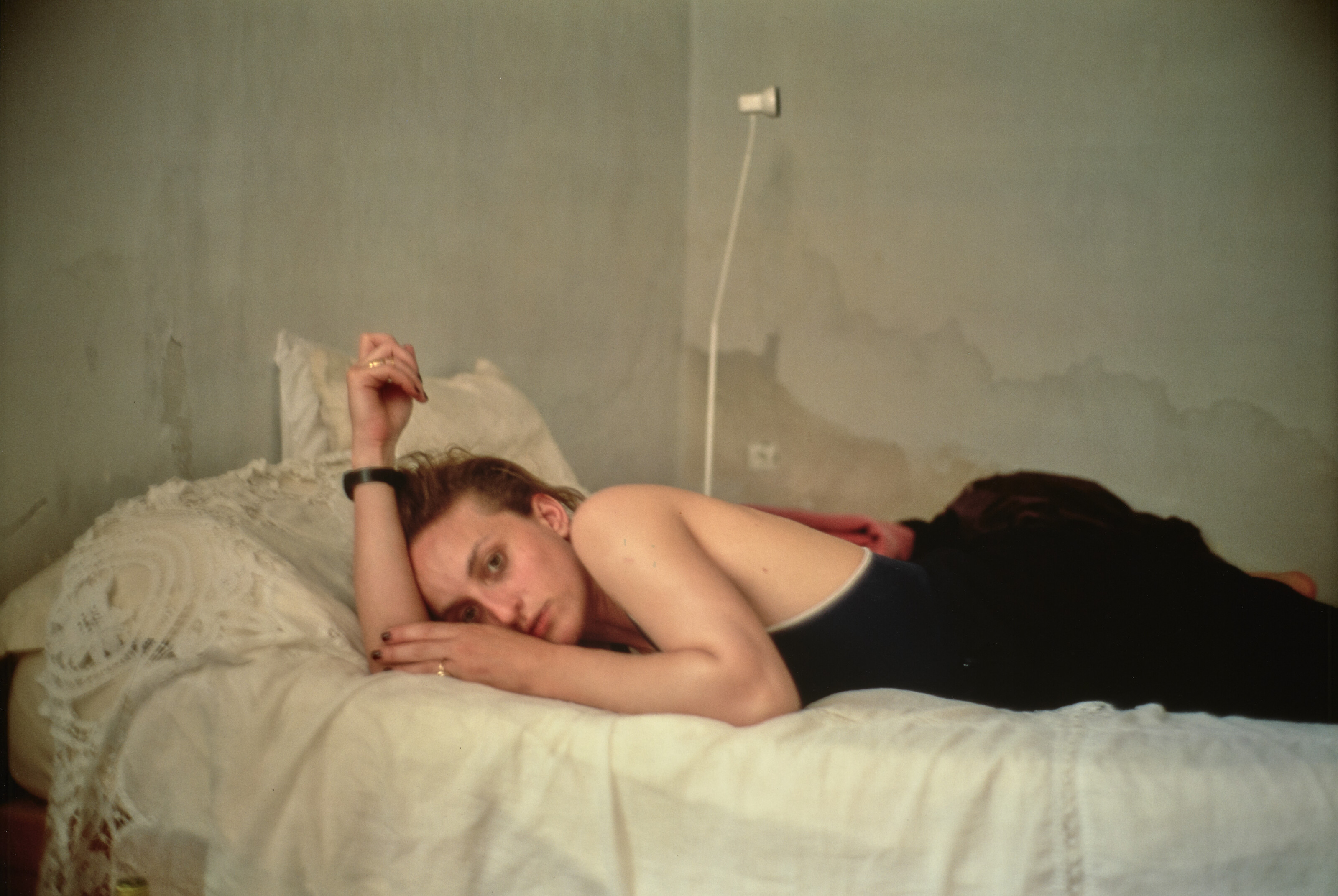 Catalog image of Rebecca on our bed, Hydra, Greece, 1995