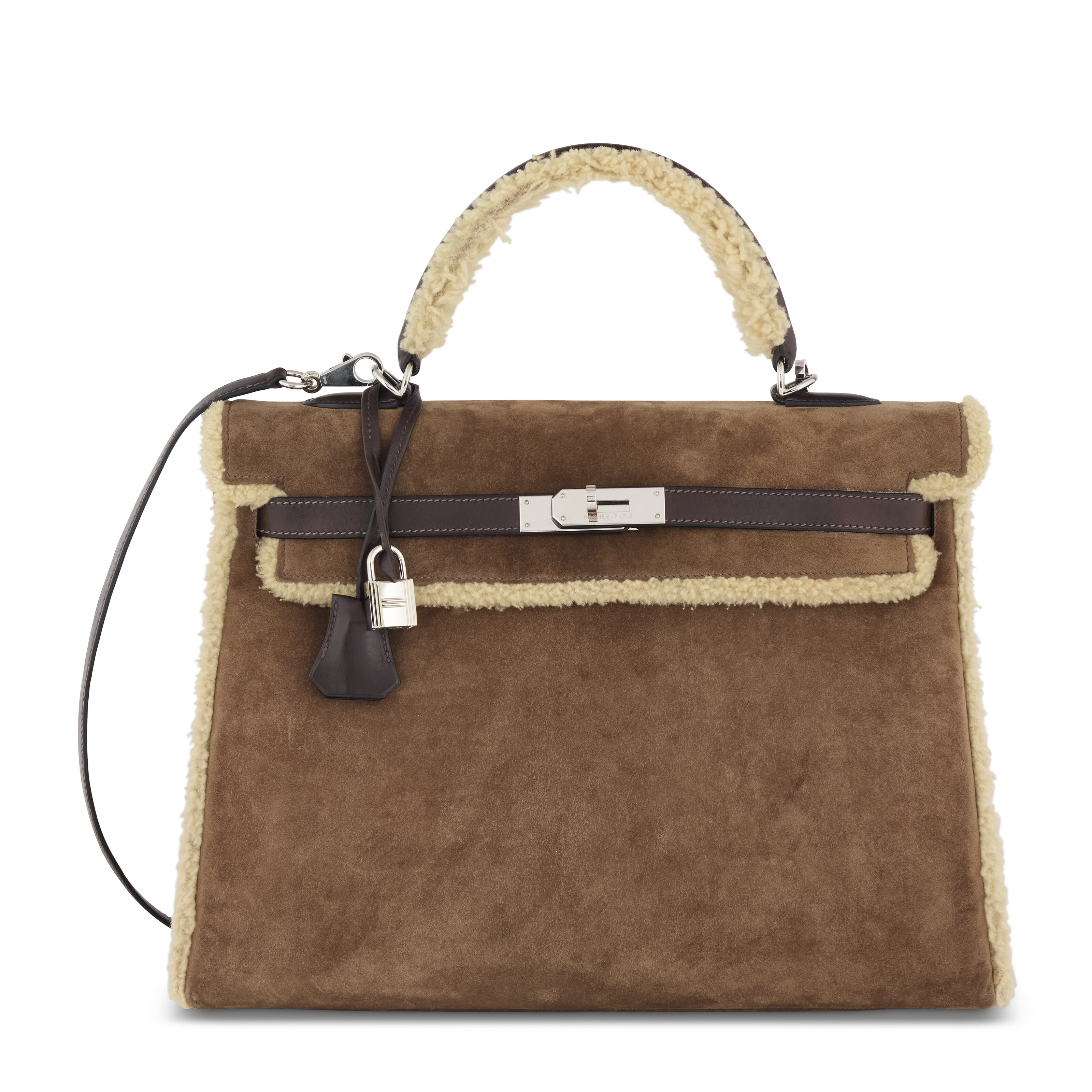 A limited edition Fauve Veau Doblis, ebene barenia and shearling Retourne Kelly Teddy 35 with palladium hardware, Hermes, 2007, offered in Handbags Online: The Paris Edit, until 24 June 2026 at Christie's Online