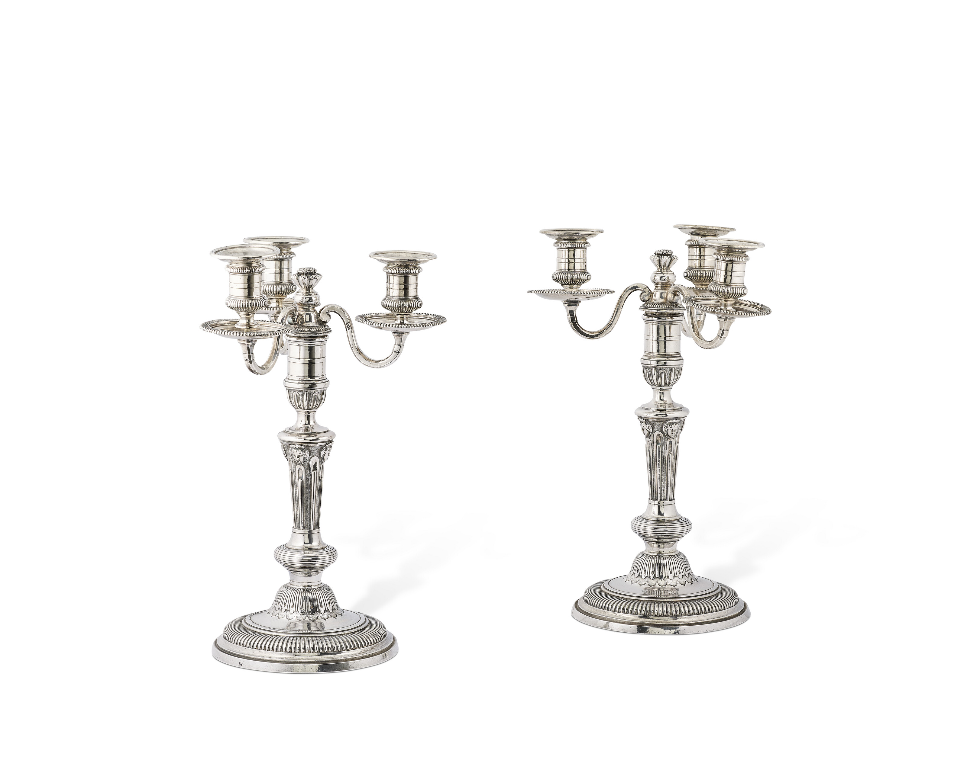A pair of Louis XV silver three-light candelabra, Paris, 1731, the candlesticks with mark of Jean Mauzie and the branches with mark of Jean Quin (Lequin), offered in Collections: incluant la succession de Francoise Lambert, vendue au profit de la Societe des Amis de Versailles, until 1 October 2026 at Christie's Online