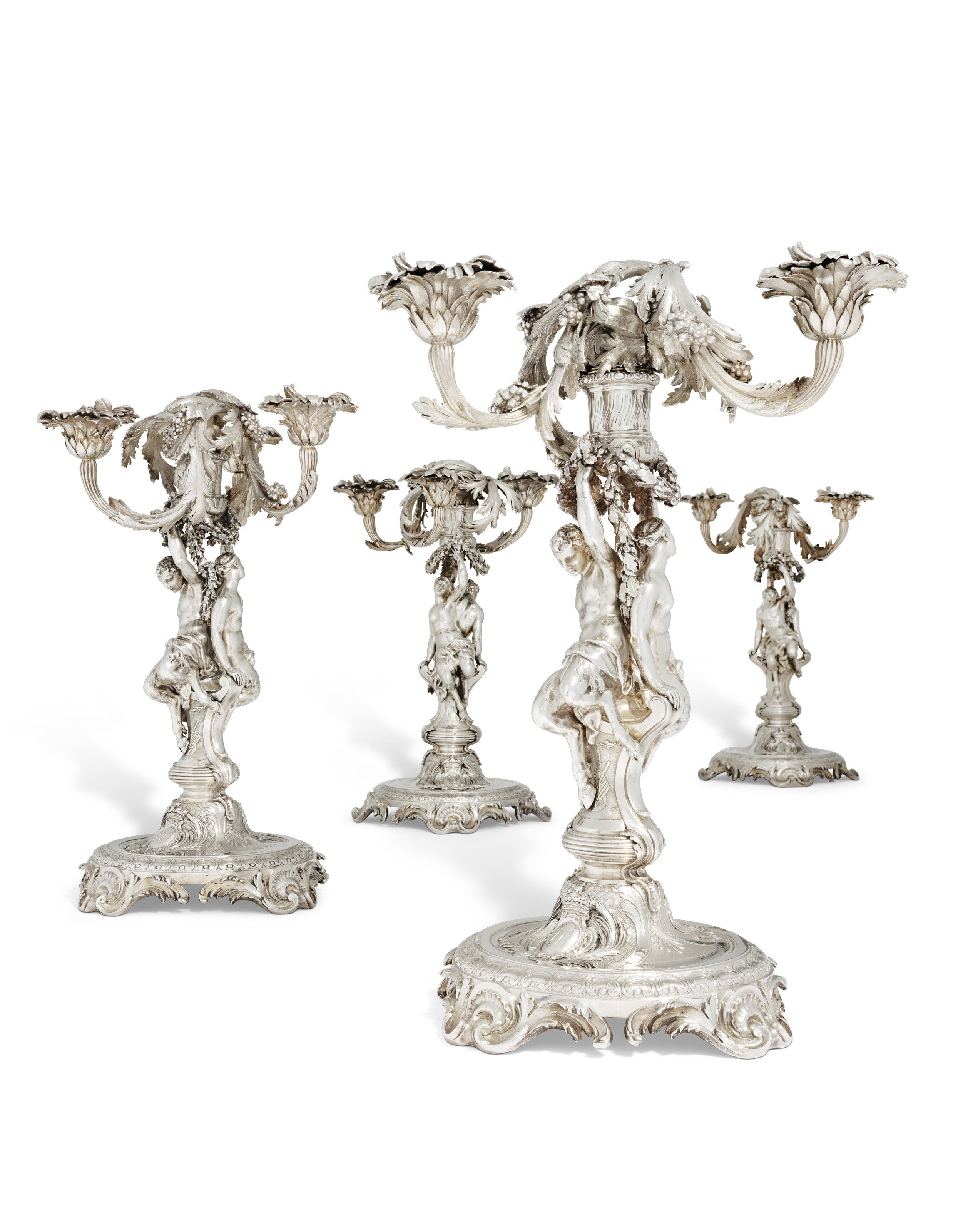 Four Louis XV silver three-light candelabra from the Portuguese royal service, made in Paris. The candlesticks with the mark of Thomas Germain, 1732 and 1734; the branches with the mark of Francois-Thomas Germain, 1756, offered in the Graziella Patino de Ortiz Linares Collection - Evening Sale on 23 September 2026 at Christie's in Paris
