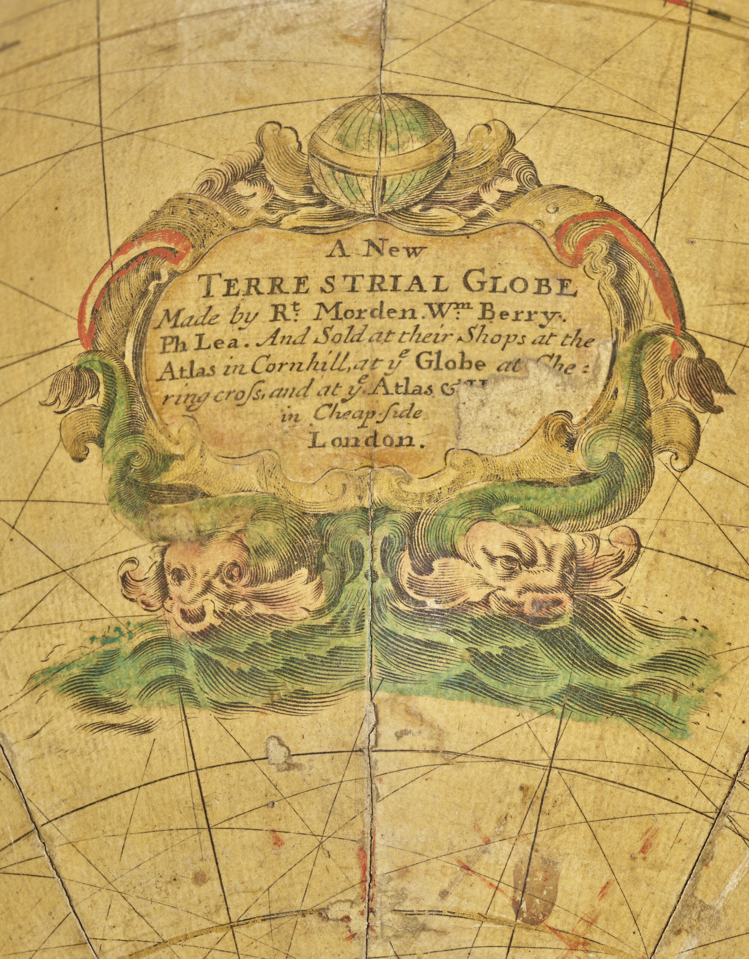 The cartouche of the terrestrial globe, naming Morden, Berry and Lea as its makers