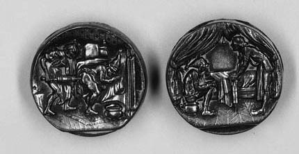 A rare pair of silver-plated buttons