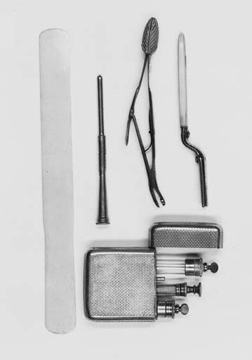 A nickel-plated cased pocket syringe set
