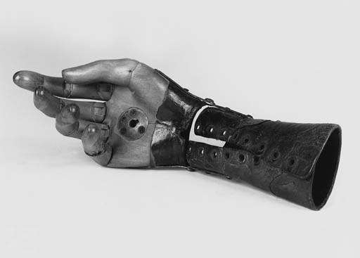 A carved wood articulated hand,