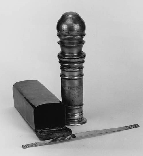 A cylindrical pewter nutmeg grinder,