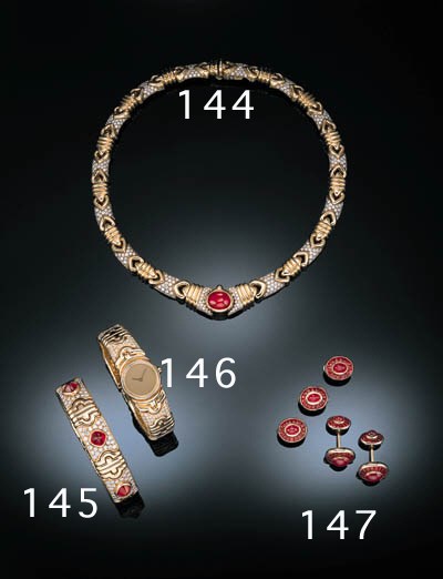 AN ELEGANT GENTLEMAN'S RUBY DRESS SET