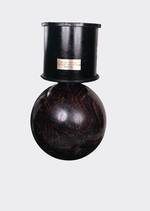 A Tigeriron Sphere and Wooden Base