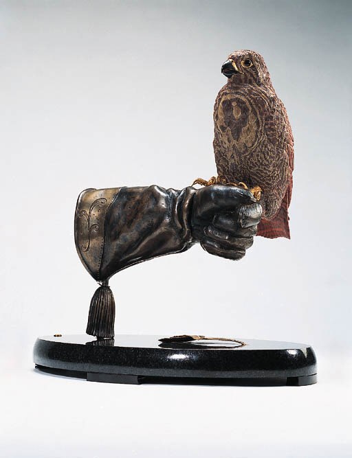 A Dolomite Falcon and Gloved Hand