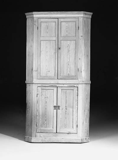 A pine corner cupboard, 18th century